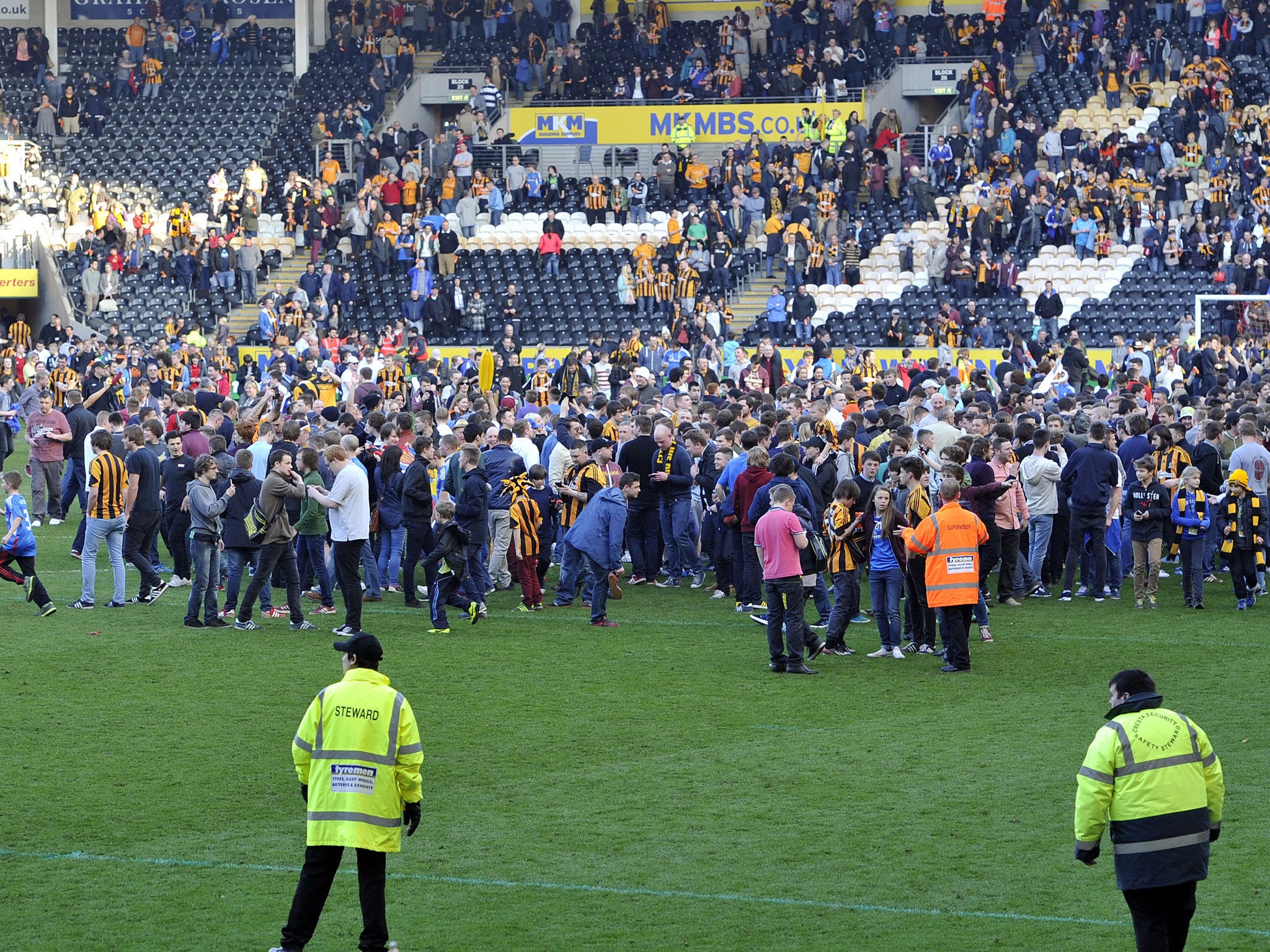 Fans invade the pitch after the final whistle (GETTY)