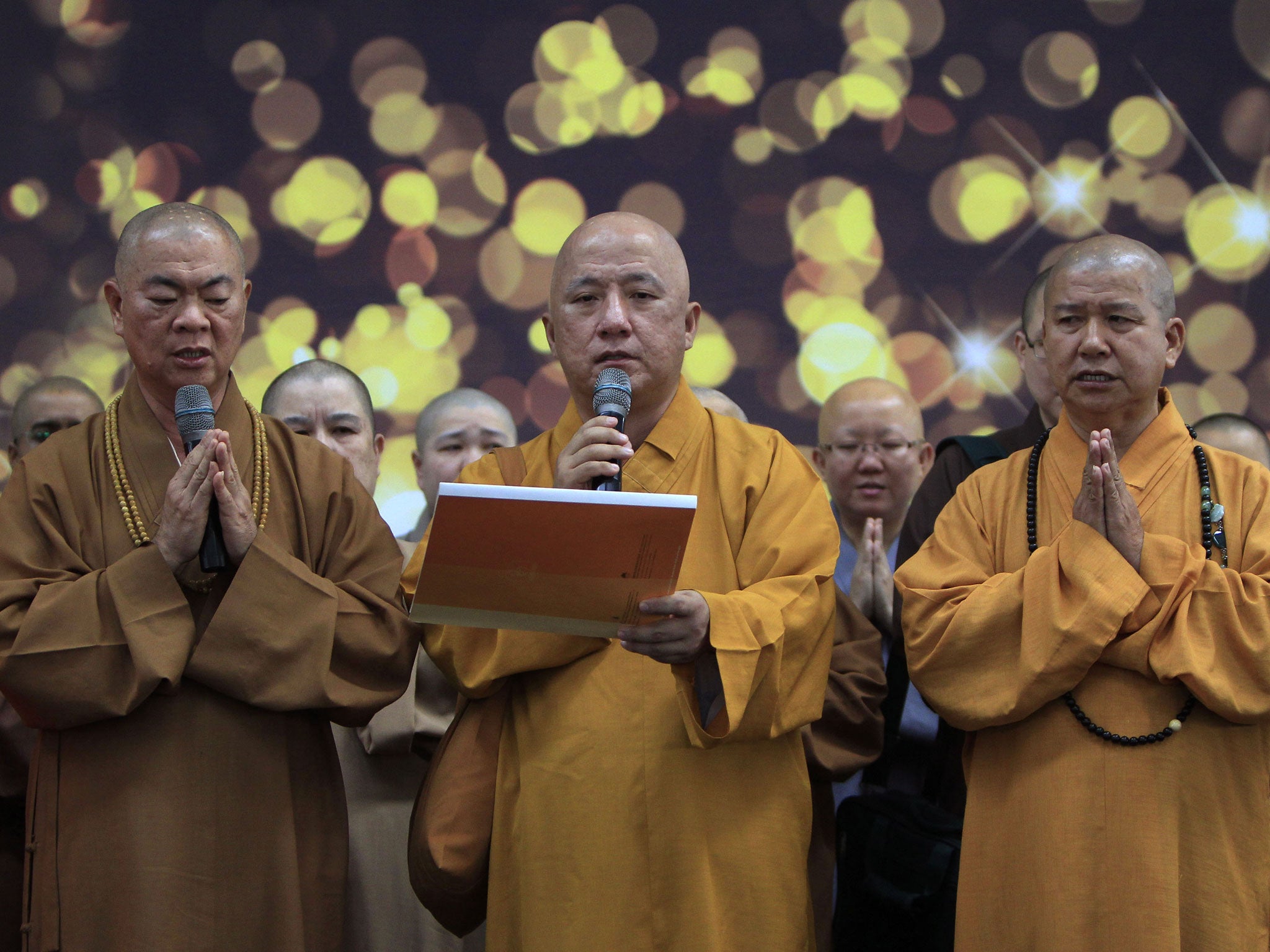 Buddhist monks offer prayers in Kuala Lumpur