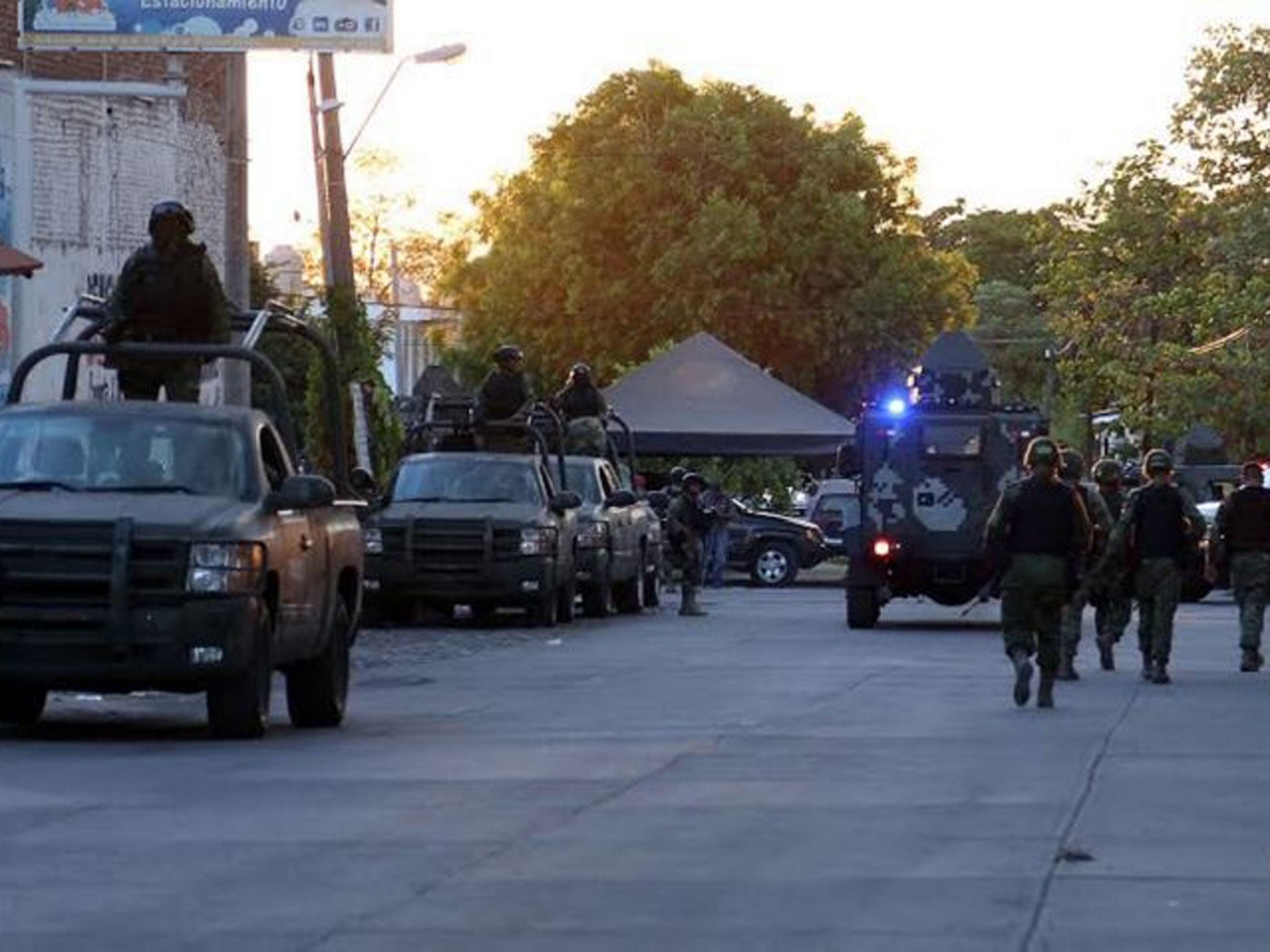 Mexican marines and soldiers guard the surroundings of the morgue where the alleged corpse of Nazario Moreno aka "El Chayo", the leader of "Los Caballeros Templarios" drug cartel, remains.