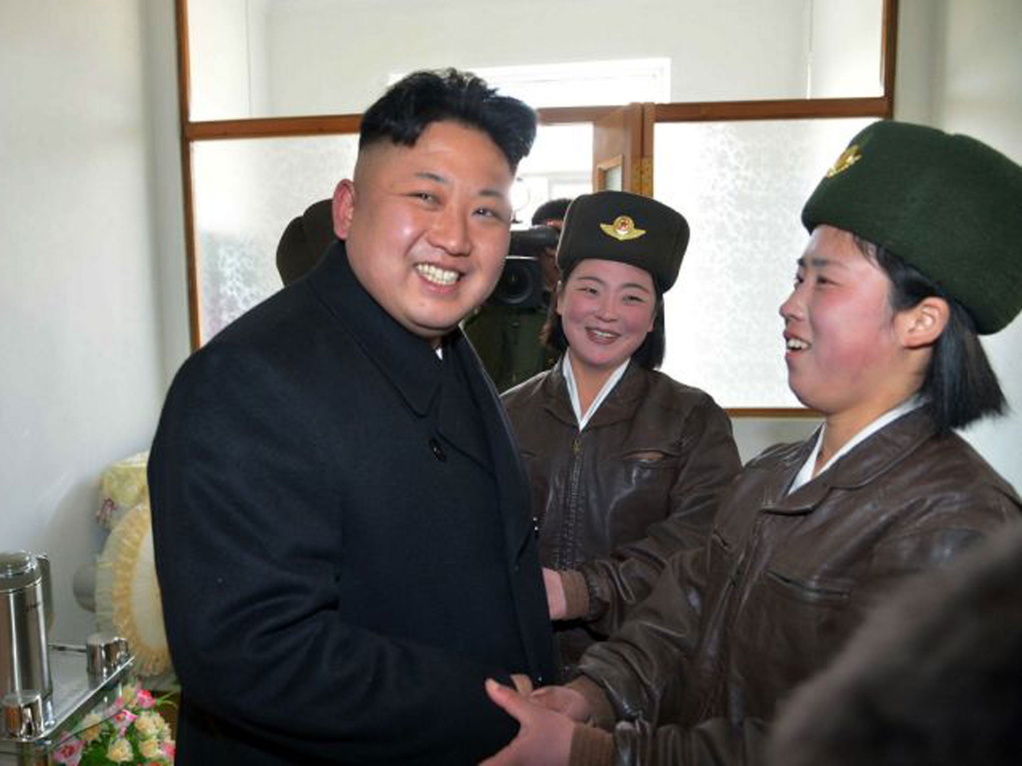 North Korea leader Kim Jong-un, pictured with pilots this month, is accused of human rights abuses