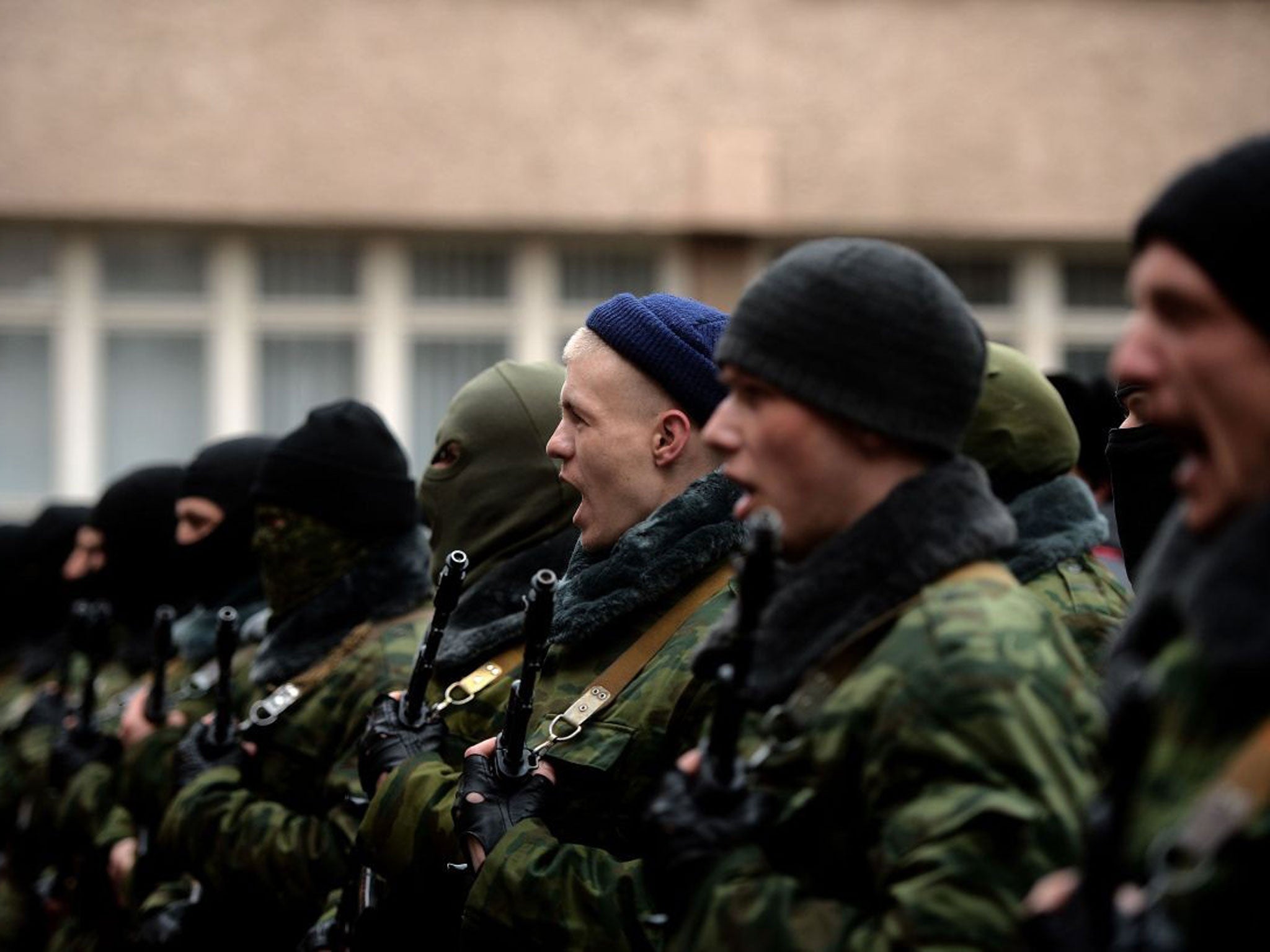 Pro-Russian forces dubbed the "military forces of the autonomous republic of Crimea" attend their swearing-in ceremony in Simferopol.