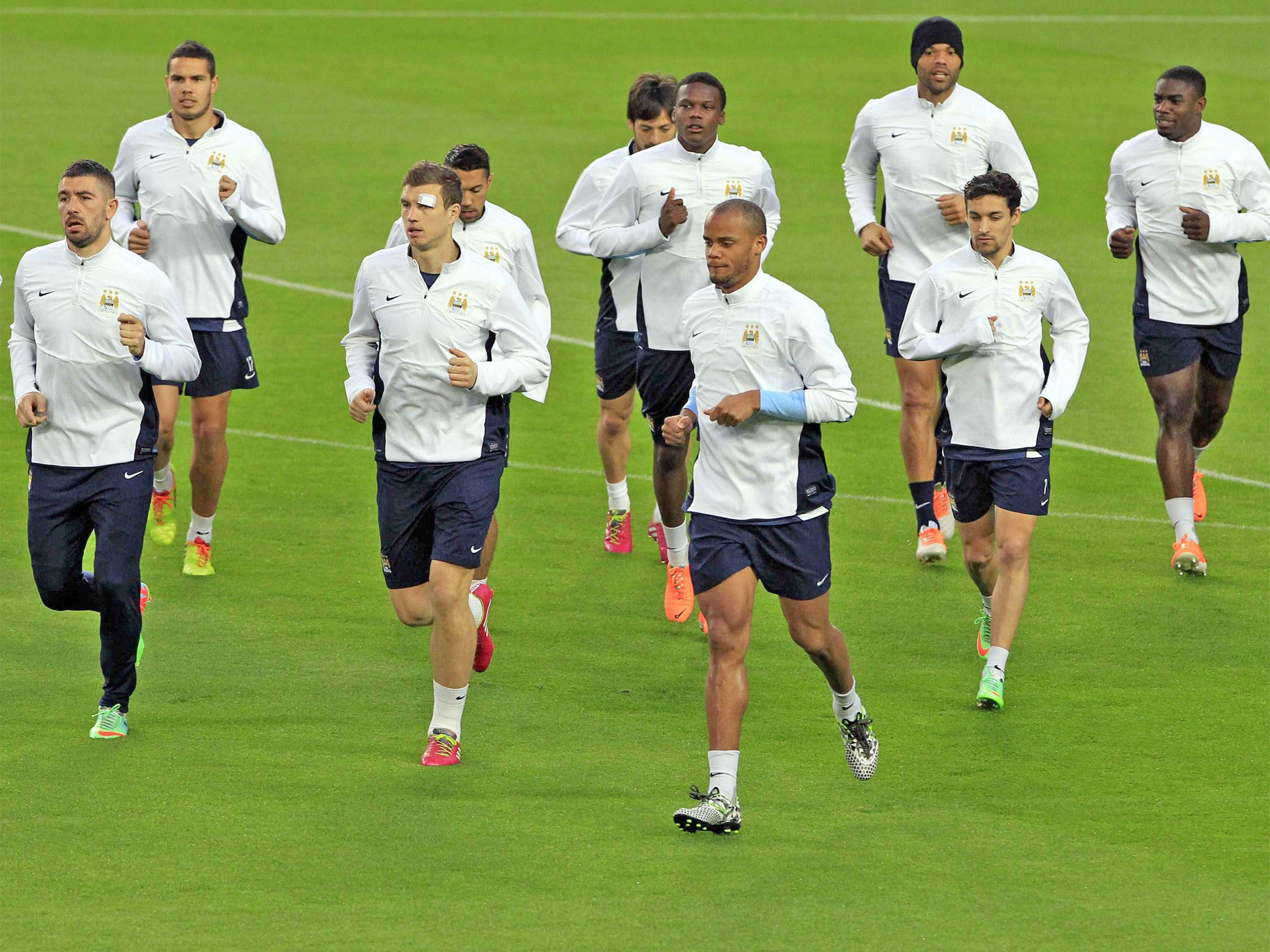 Vincent Kompany (front) leads City at the Nou Camp