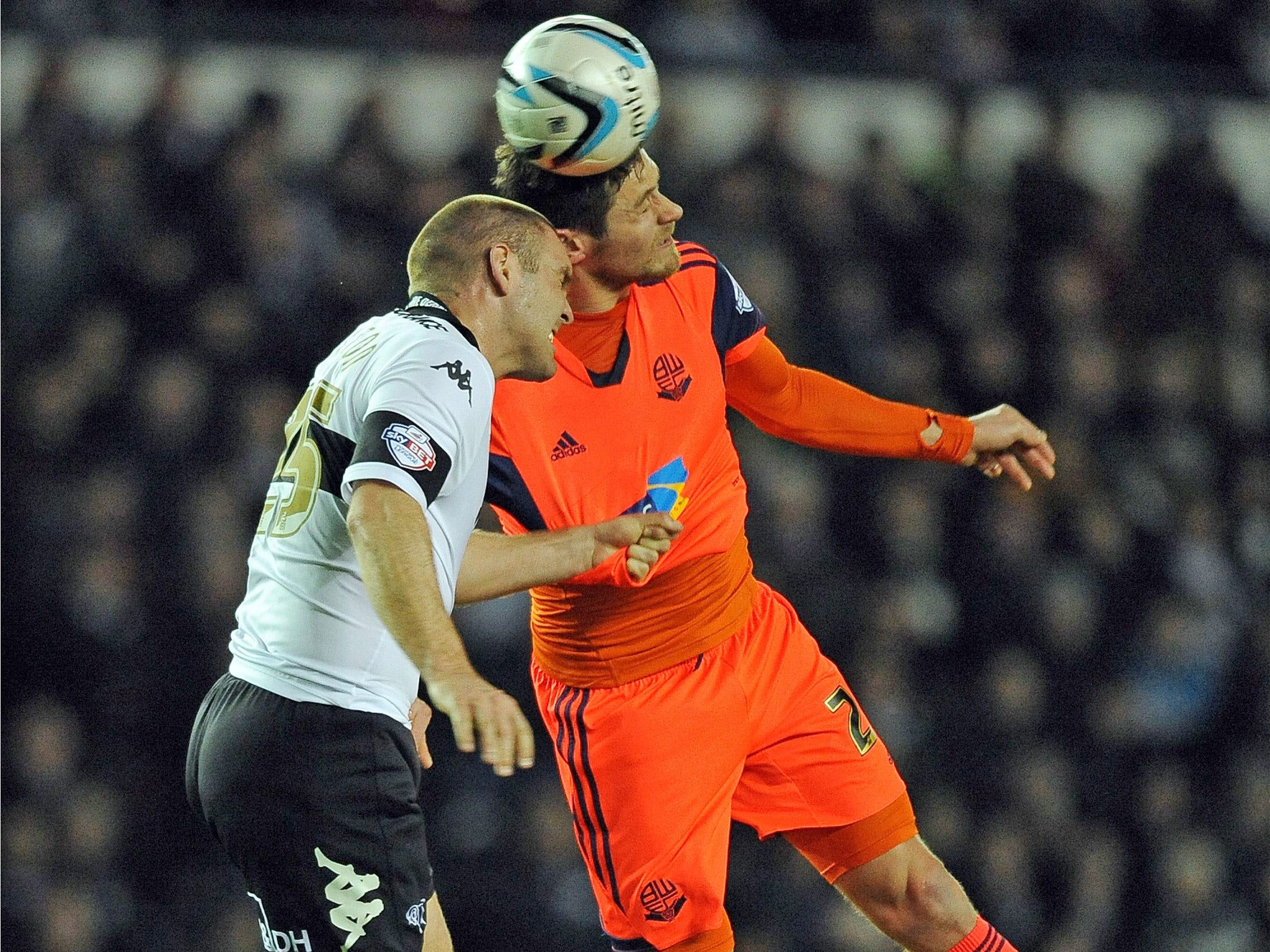 An aerial battle between Derby's Shaun Barker and Bolton's Lukas Jutkiewicz