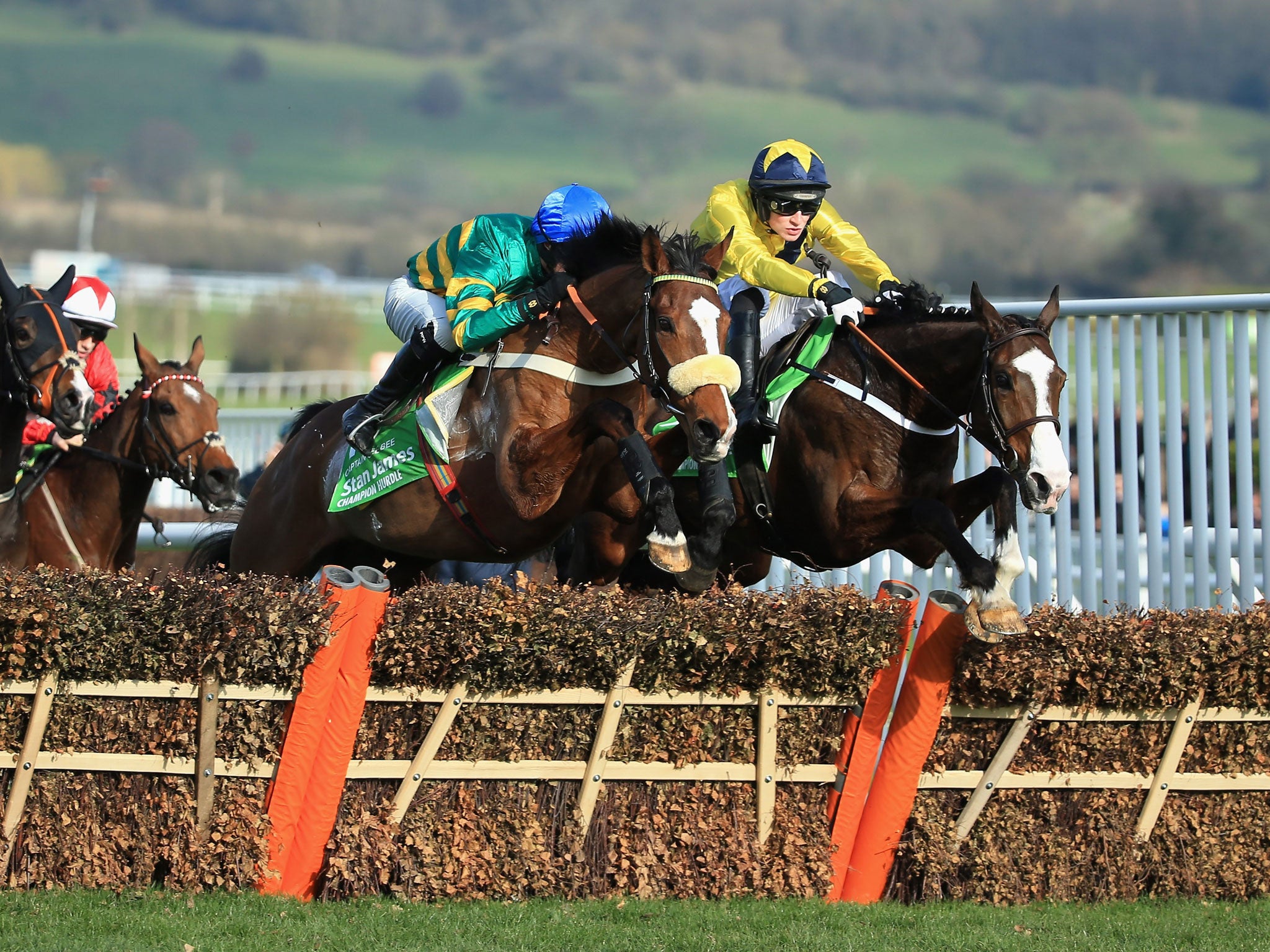 Daniel Mullins on Our Conor (R) leads the pack early on in The Stan James Champion Hurdle, in which he later fell