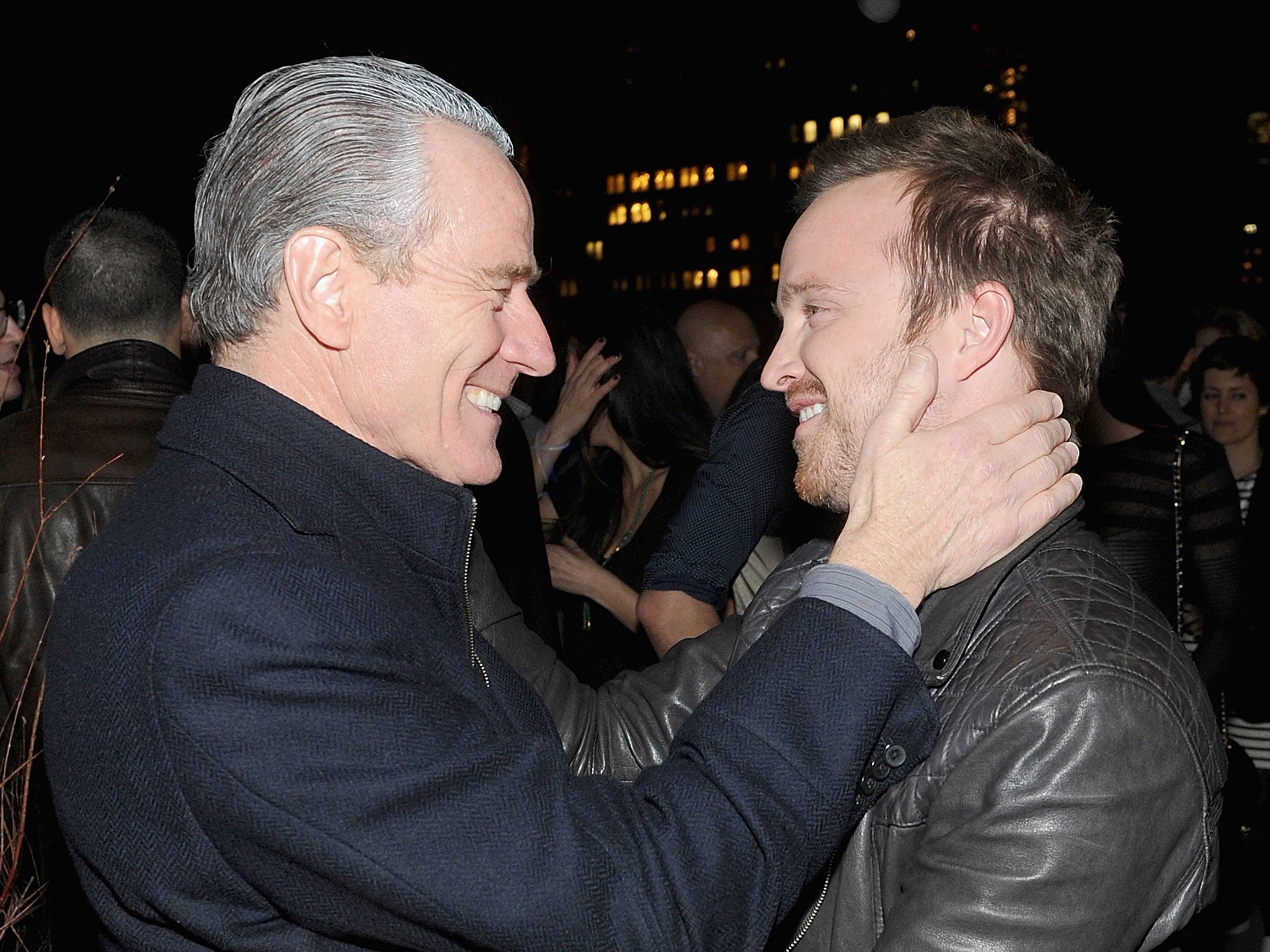 Bryan Cranston and Aaron Paul embrace at the screening