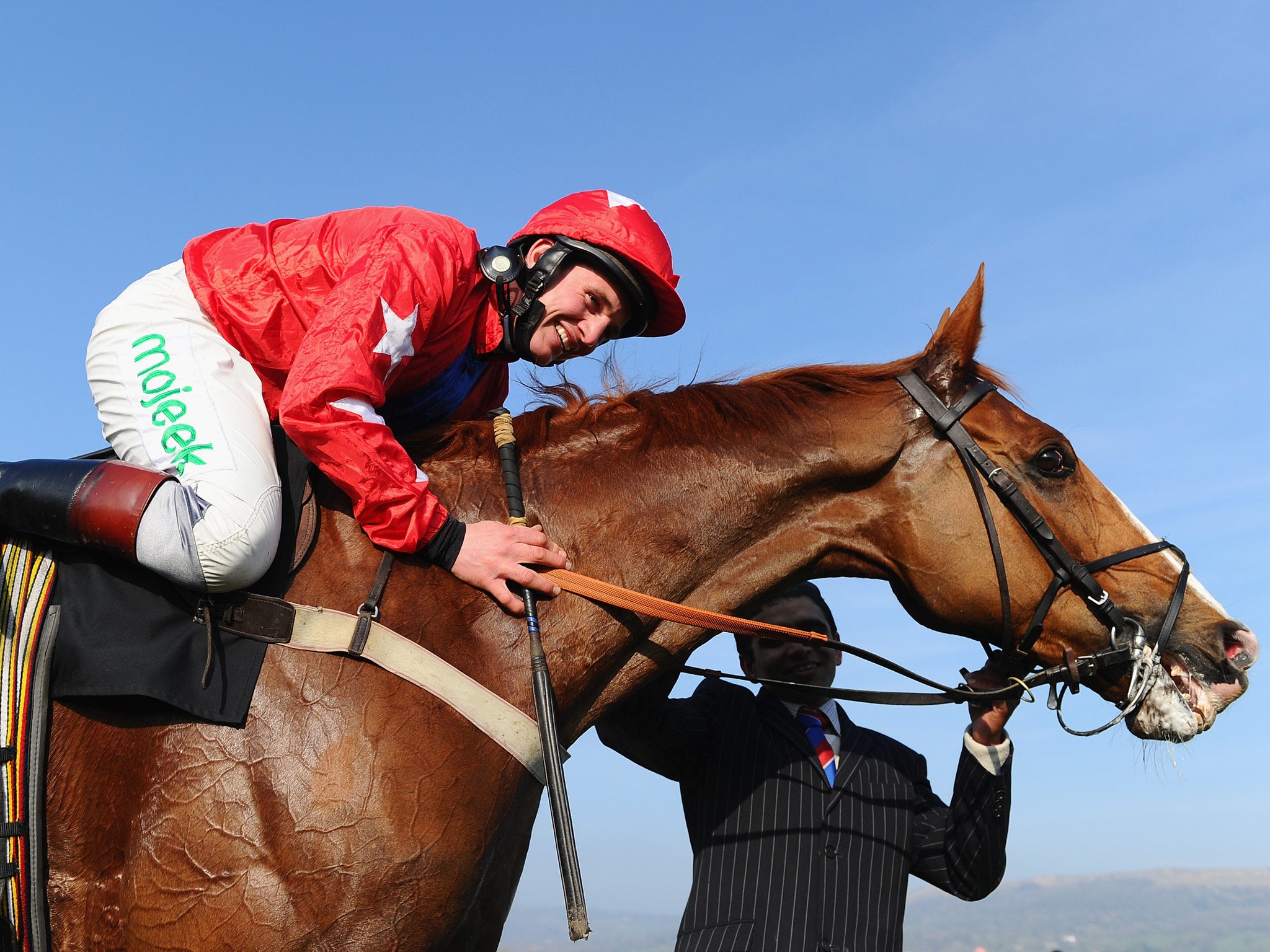 Jamie Moore and Sire de Grugy celebrate victory in the BetVictor Queen Mother Champion Chase during Ladies Day at Cheltenham Festival