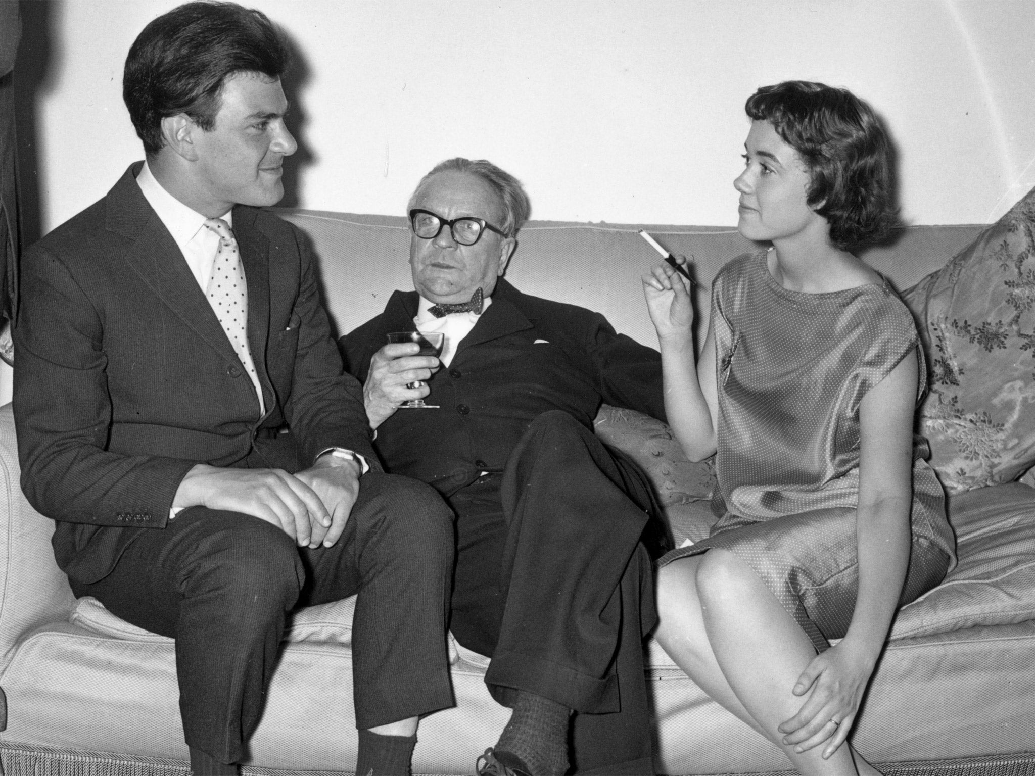 Raymond Chandler, centre, at a party in London in 1958 (Getty)