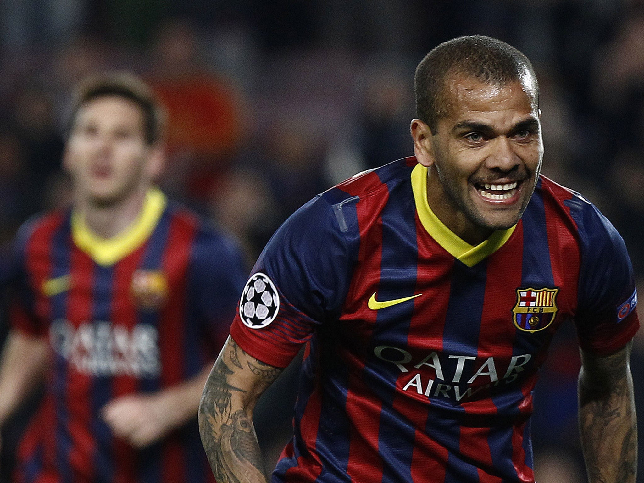 Dani Alves celebrates Barcelona's second goal against Manchester City