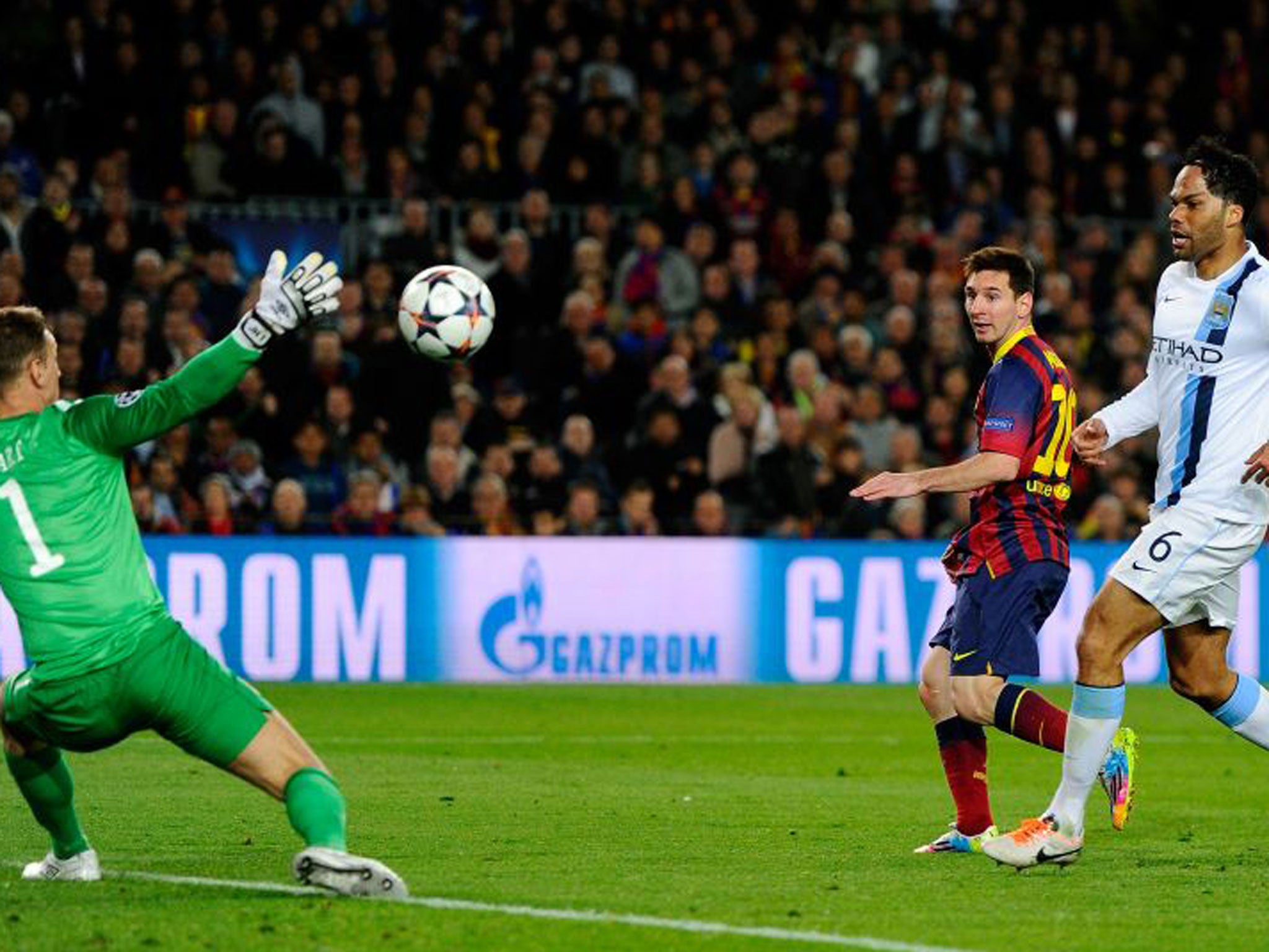 Lionel Messi dinks the ball over Joe Hart (GETTY)