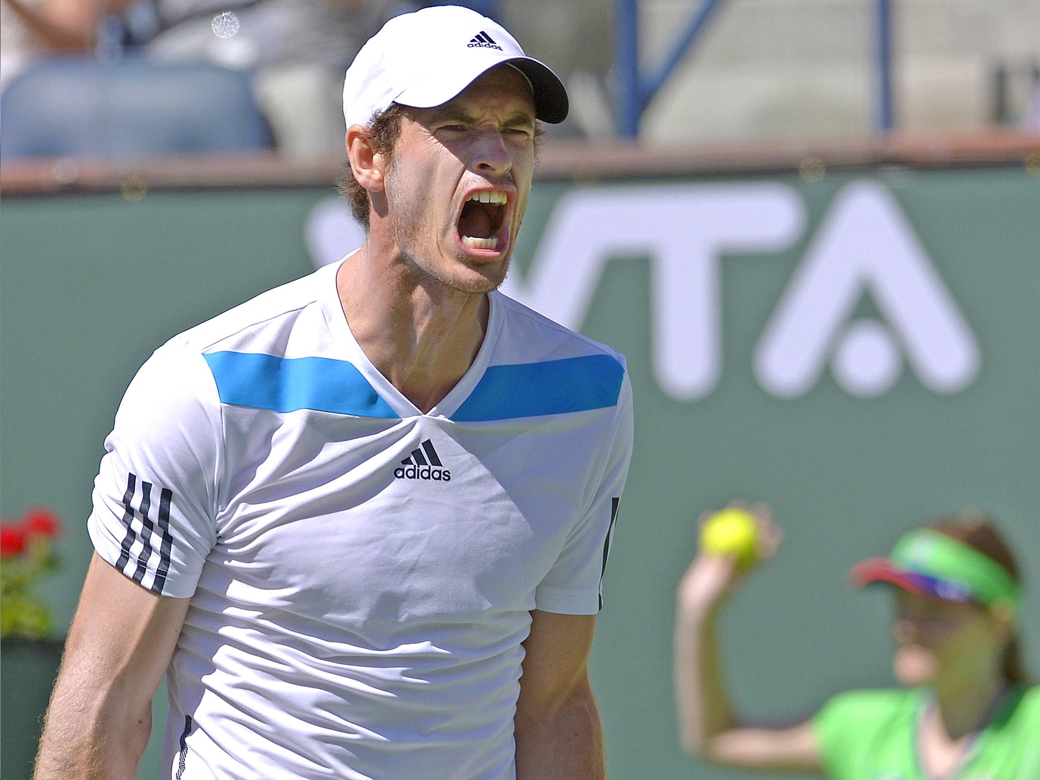 Andy Murray reacts after losing a point to Canada’s Milos Raonic