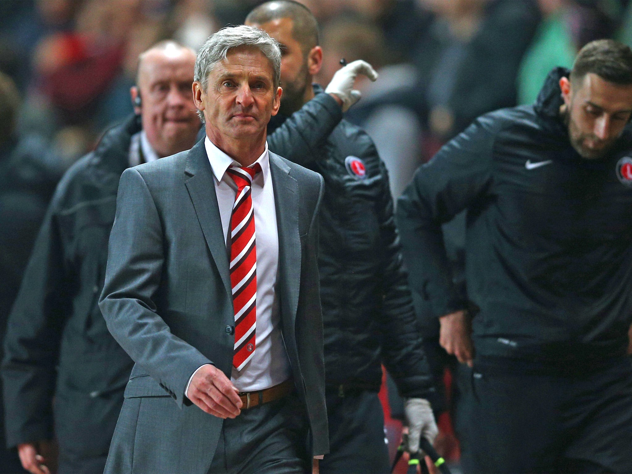 Jose Riga walks to the Charlton dugout