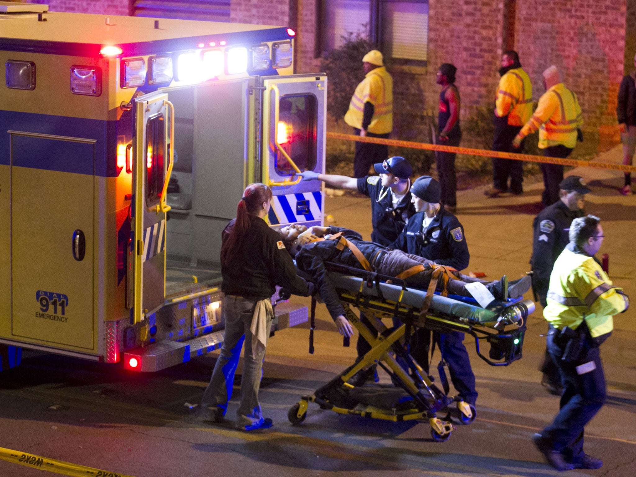 A man is transported to an ambulance after being struck by a vehicle