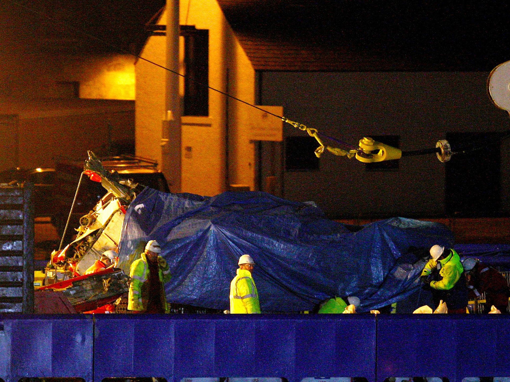 The helicopter being brought ashore after fourteen oil workers and two crew died when a Bond Super Puma plunged into the water off the Aberdeenshire coast on 1 April, 2009, as an inquiry into the crash has found that the accident could have been avoided