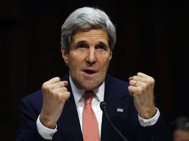 U.S. Secretary of State John Kerry makes fists while speaking about the crisis in Ukraine during a hearing held by the Subcommittee on State, Foreign Operations, and Related Programs to examine proposed budget estimates for fiscal year 2015 for the Department of State and Foreign Operations in Washington, March 13, 2014.