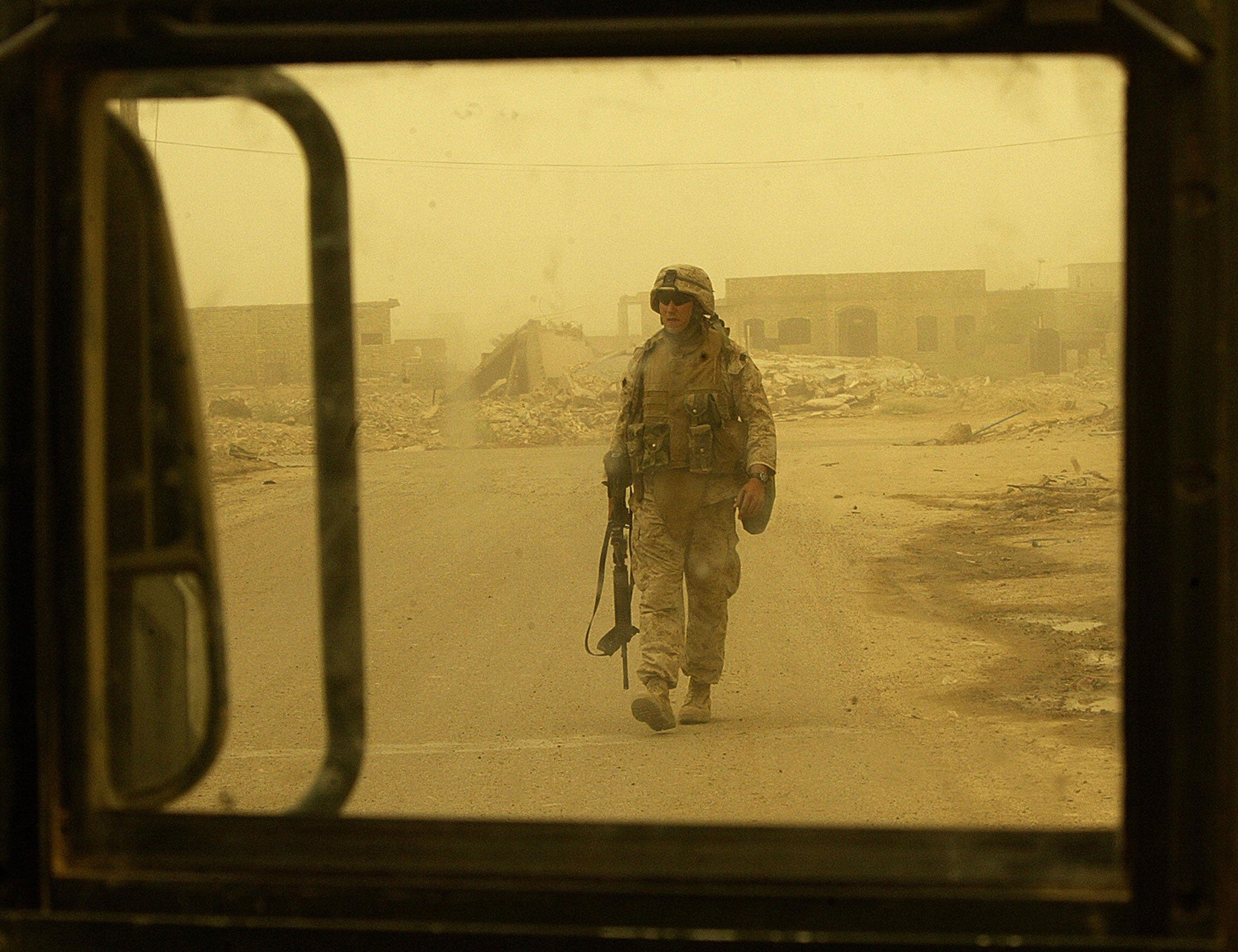 A US marine checks for possible Improvised Explosive Device (IED) in the city of Fallujah, Iraq