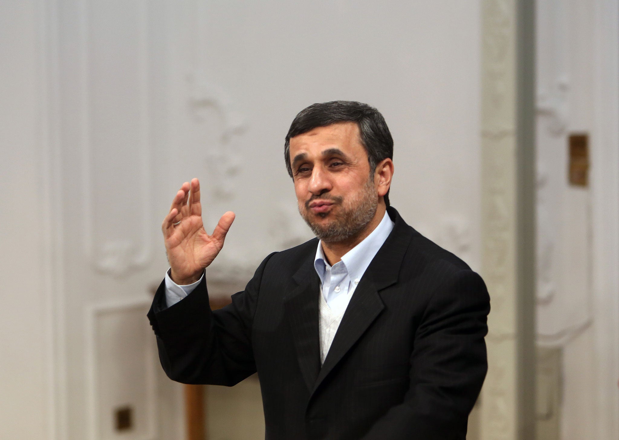 President Ahmadinejad: 'Wields axe to cement his position'