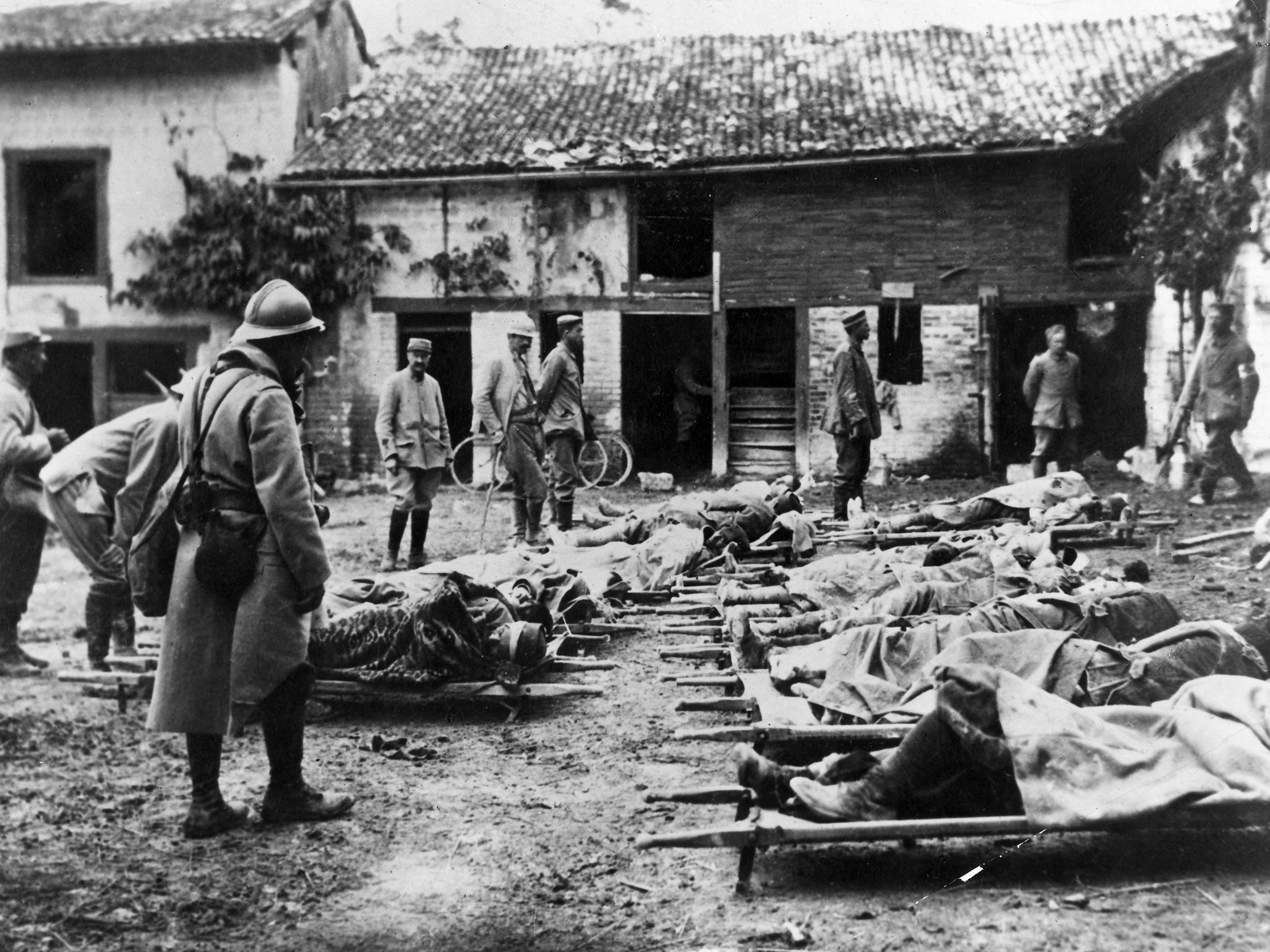 Wounded French troops in a farm after the Champagne Offensive during the Battle of Loos in France