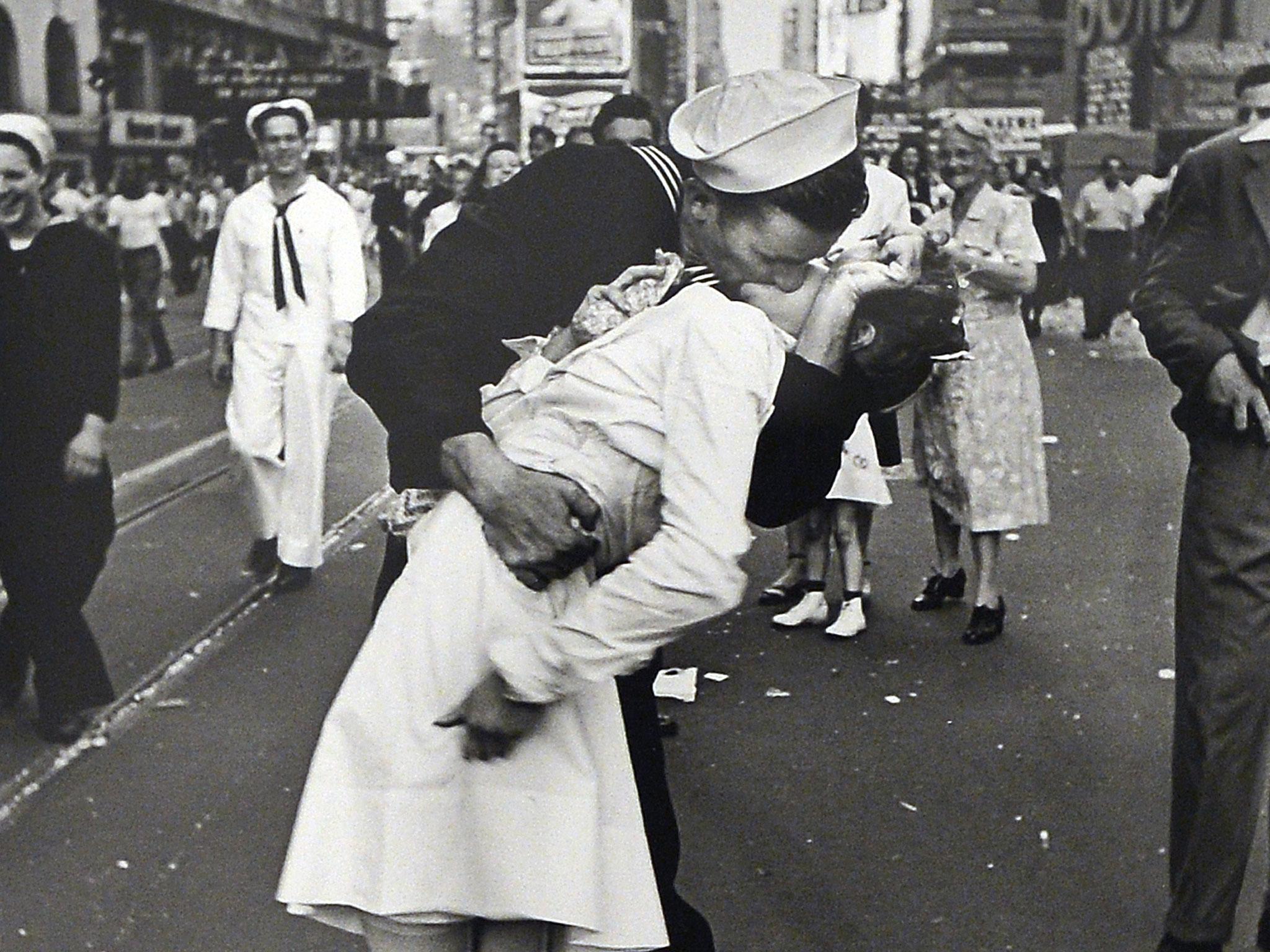 A visitor takes a snapshot of 'VJ Day a Times Square, New York, NY, 1945' by Alfred Eisenstaedt during the 'Life. I grandi fotografi' (Life. The great photographers) exhibition at the auditorium on April 30, 2013 in Rome. The exhibition showing some 150 pictures taken from 1936 when the US magazine Life magazine premiered will be open from May, 1 to August 4, 2013.