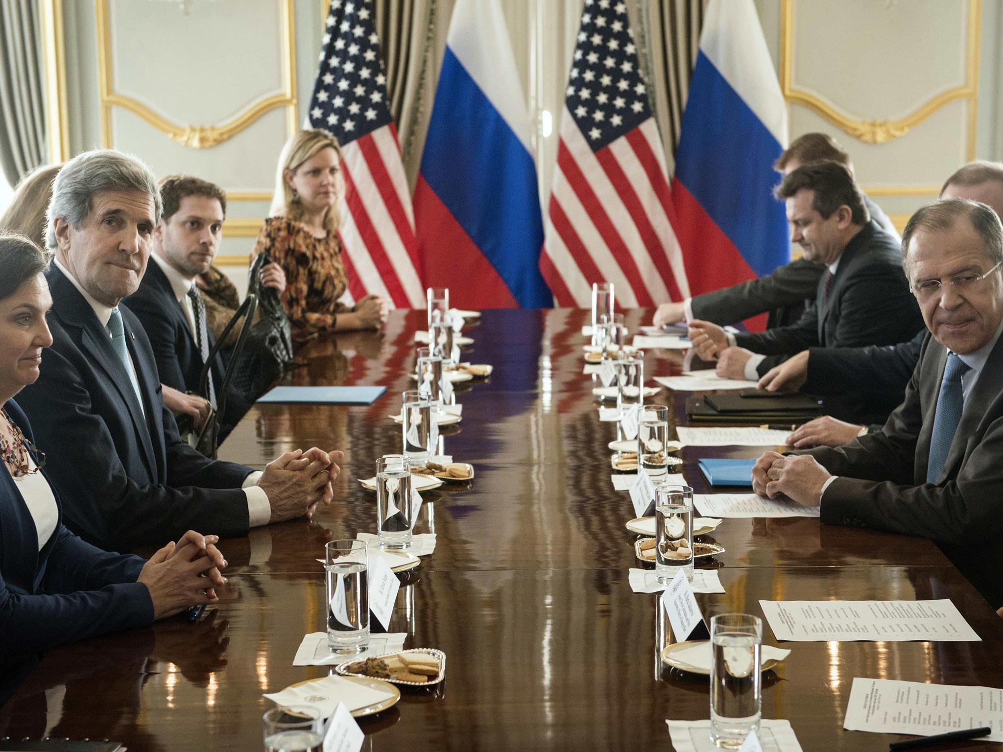 John Kerry, the US Secretary of State (second left), sits opposite Russia’s Foreign Minister, Serge Lavrov, at their failed meeting on Ukraine at the American ambassador’s home in London yesterday