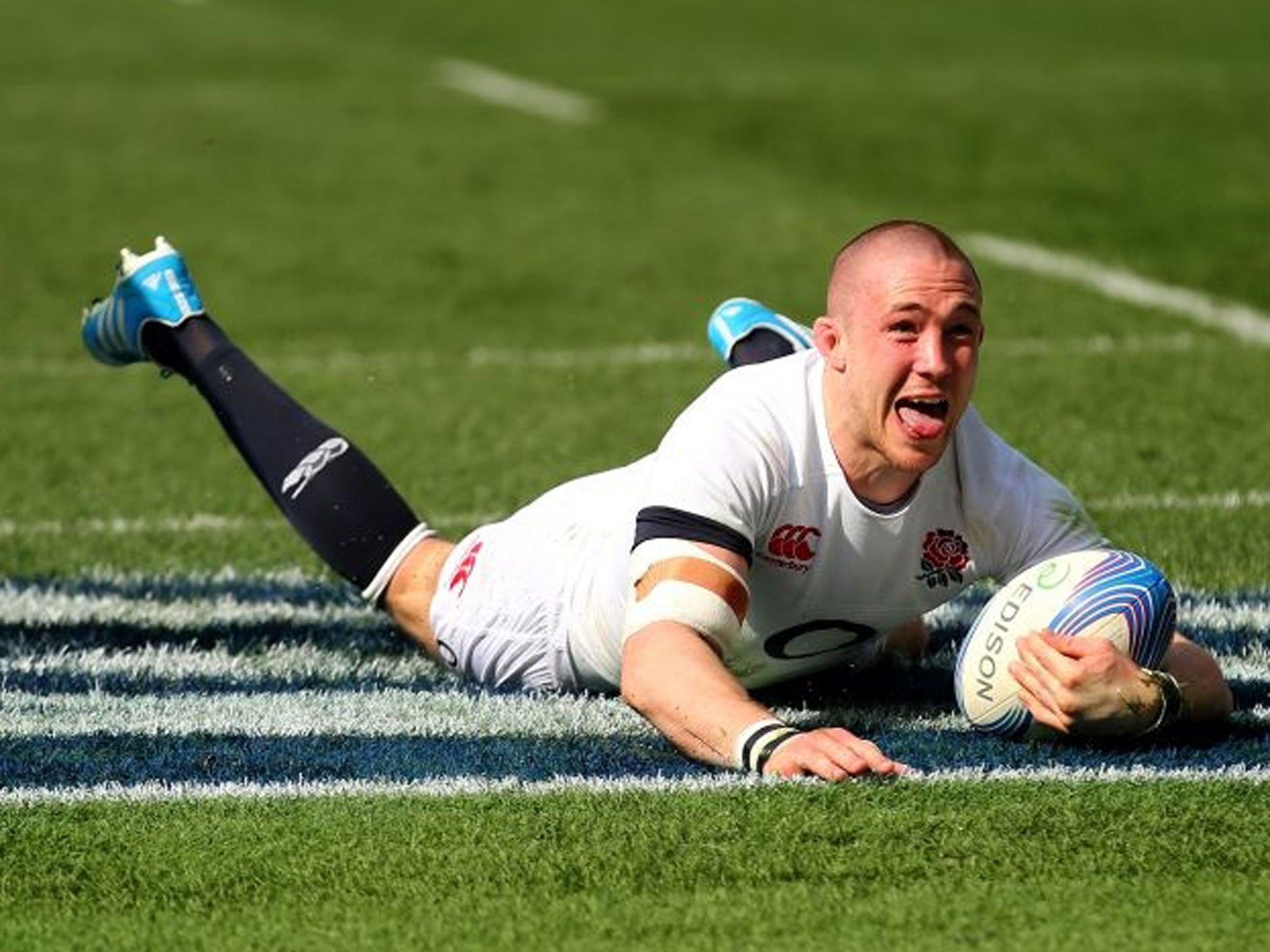 Mike Brown of England celebrates after scoring the first try during the Six Nations match between Italy and England at the Stadio Olimpico