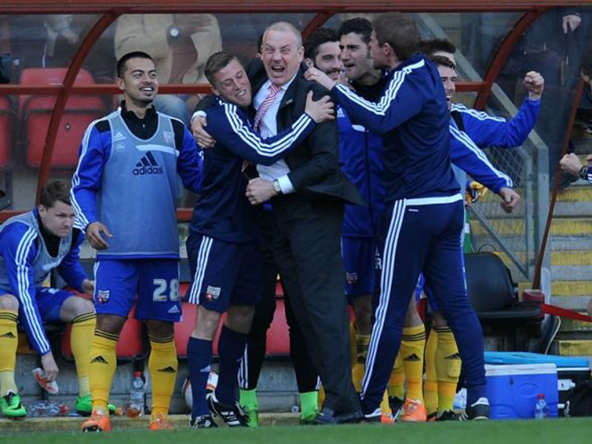 Hot to trot: Brentford’s manager Mark Warburton is ecstatic after Marcello Trotta delights the visiting fans