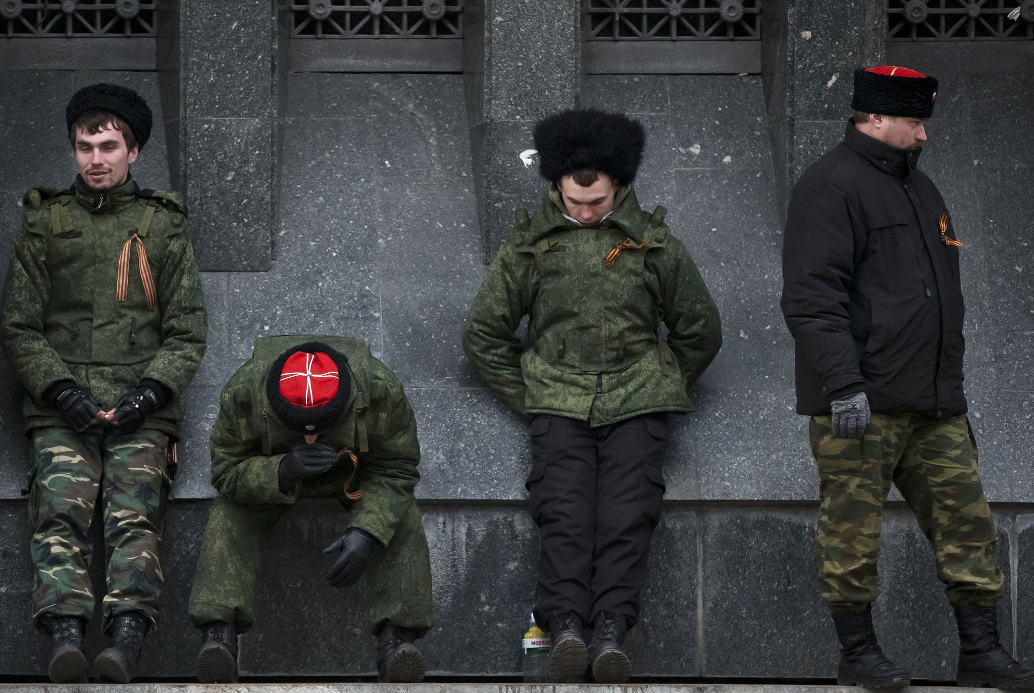 Cossacks guard the regional parliament building in Simferopol during the Crimean referendum