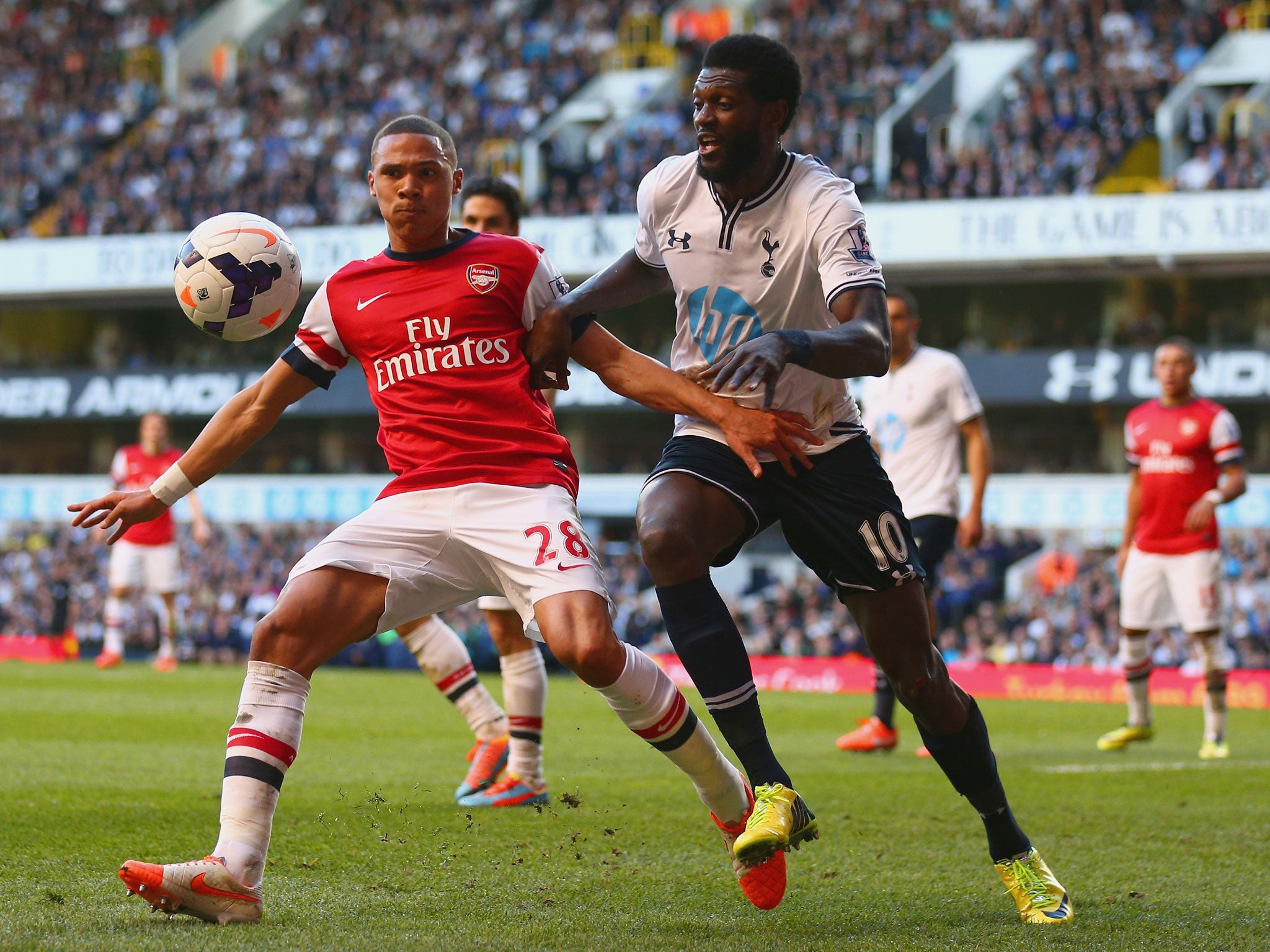 Kieran Gibbs (left) competes with Emmanuel Adebayor (GETTY)