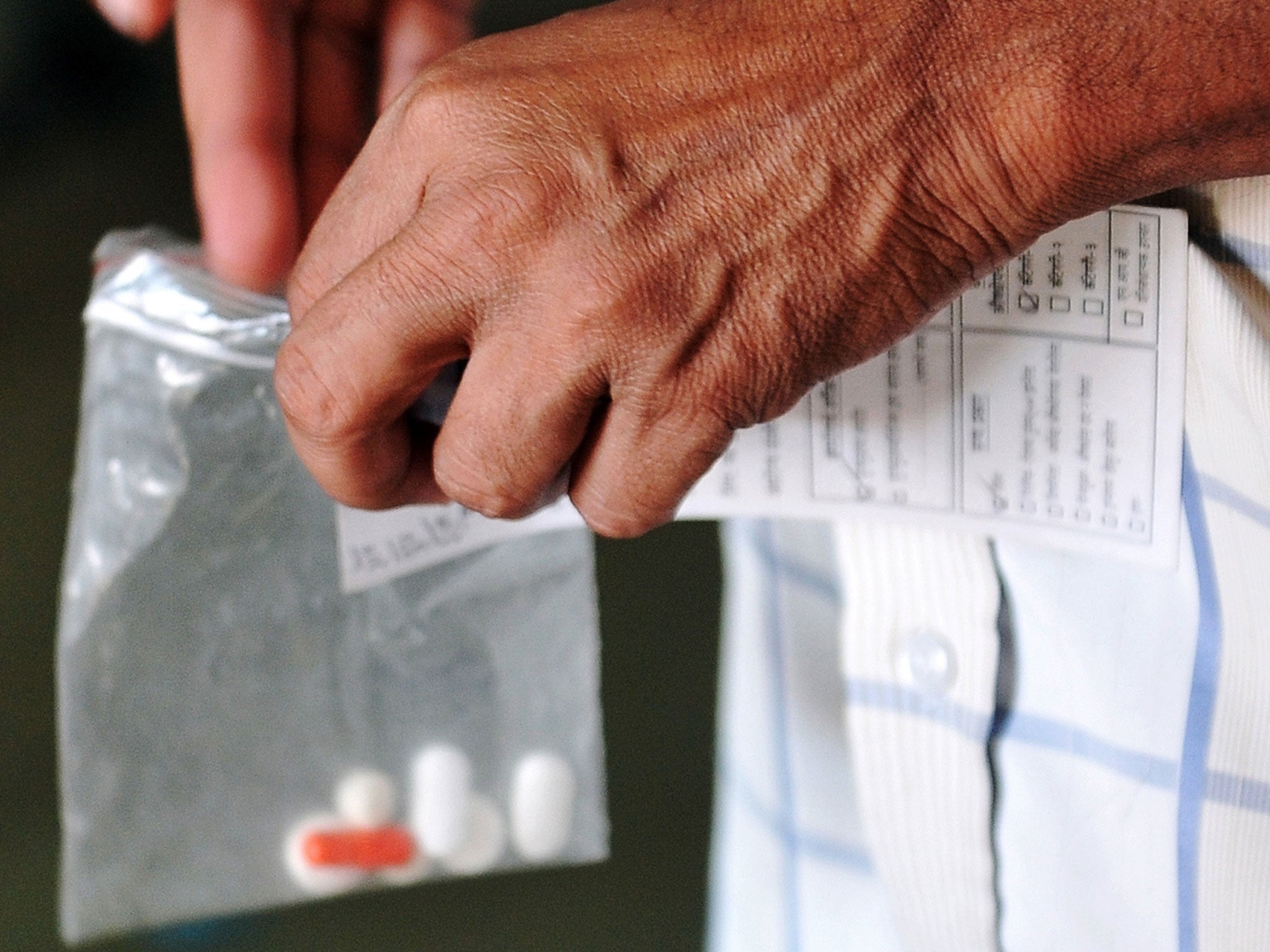 A tuberculosis patient collects his medicine at a clinic