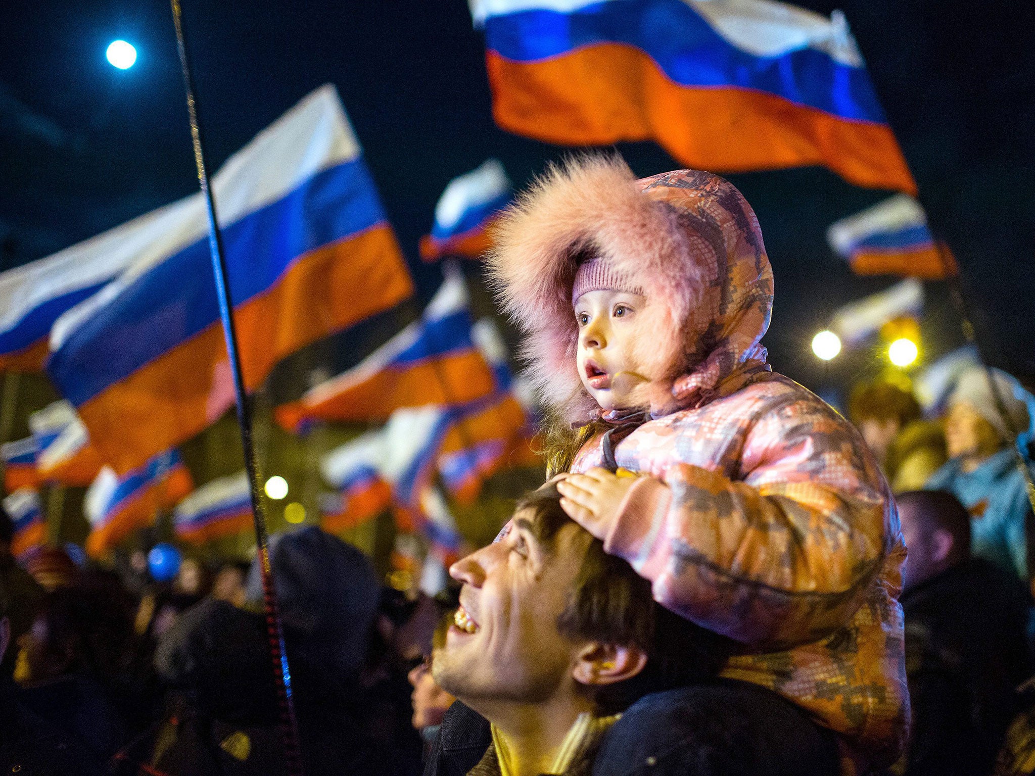 People gather in Simferopol after a referendum in Crimea. Election officials said 95.5 per cent voted in favour of joining Russia