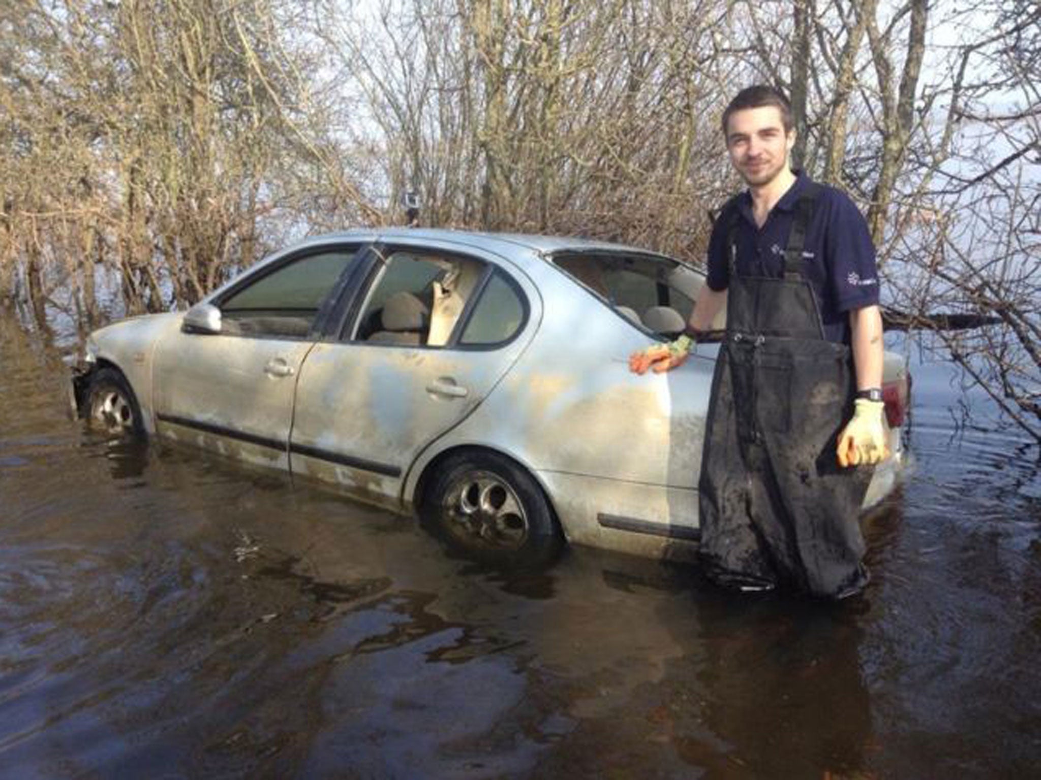 Mr Zajaczkowski, pictured here with his ruined car, said it was 'unbelievably disgusting in there' (eBay)