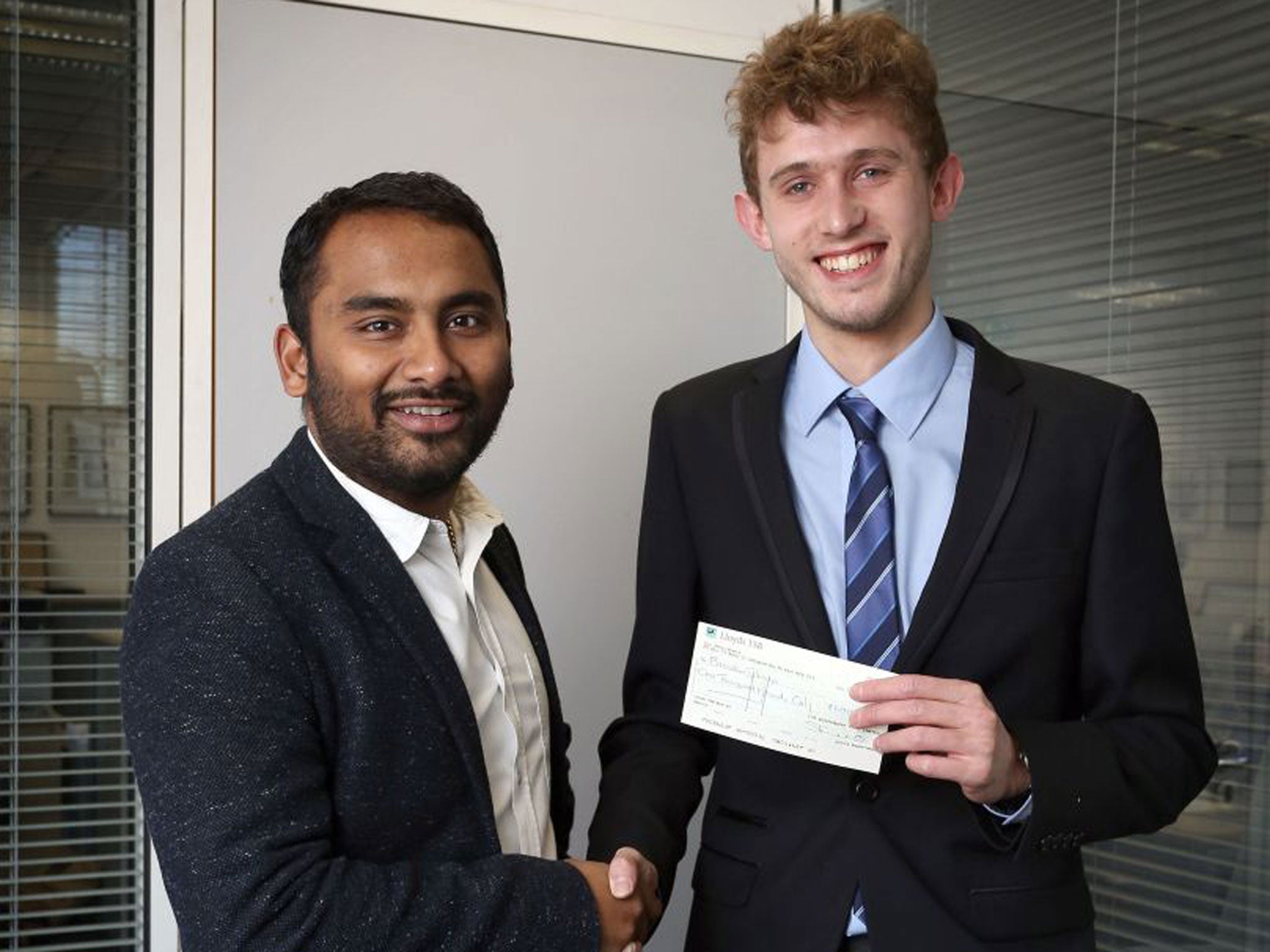 Winning words: Amol Rajan (left), editor of The Independent, presents Brendan Sharp with a cheque for £1,000