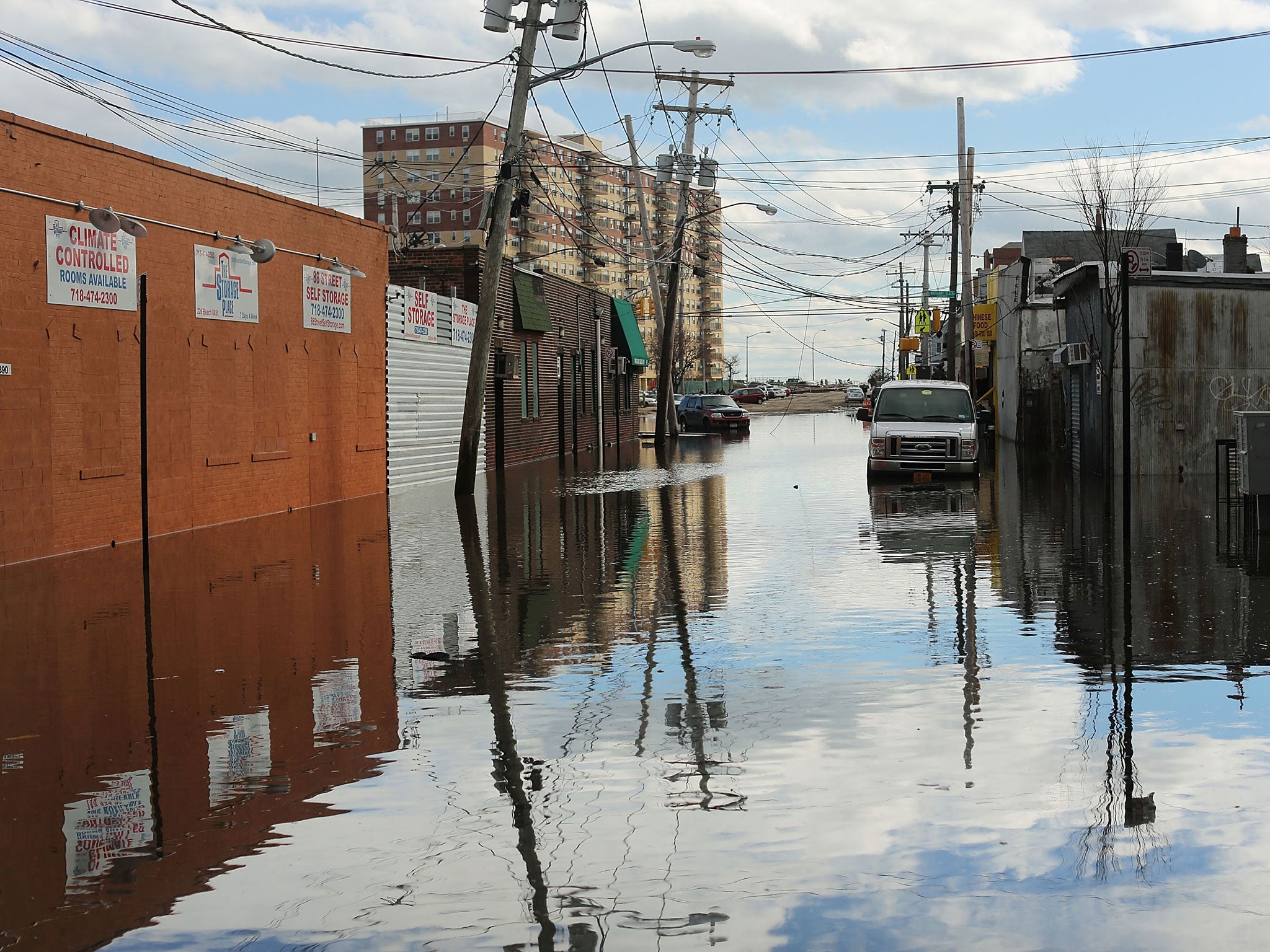Flood damaged streets in Queens, New York where the historic boardwalk was washed away due to Hurricane Sandy in 2012. The report predicts that by the end of the century “hundreds of millions of people will be affected by coastal flooding and displaced due to land loss”