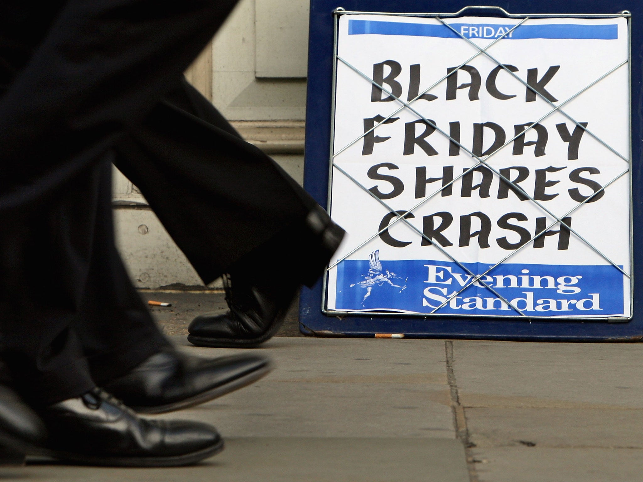 The Evening Standard headline board showing the words 'Black Friday Shares Crash' in London in October 2008 in London. The report warns a global mean temperature increase of 2.5C above pre-industrial levels may lead to global aggregate economic losses of between 0.2 and 2.0 per cent