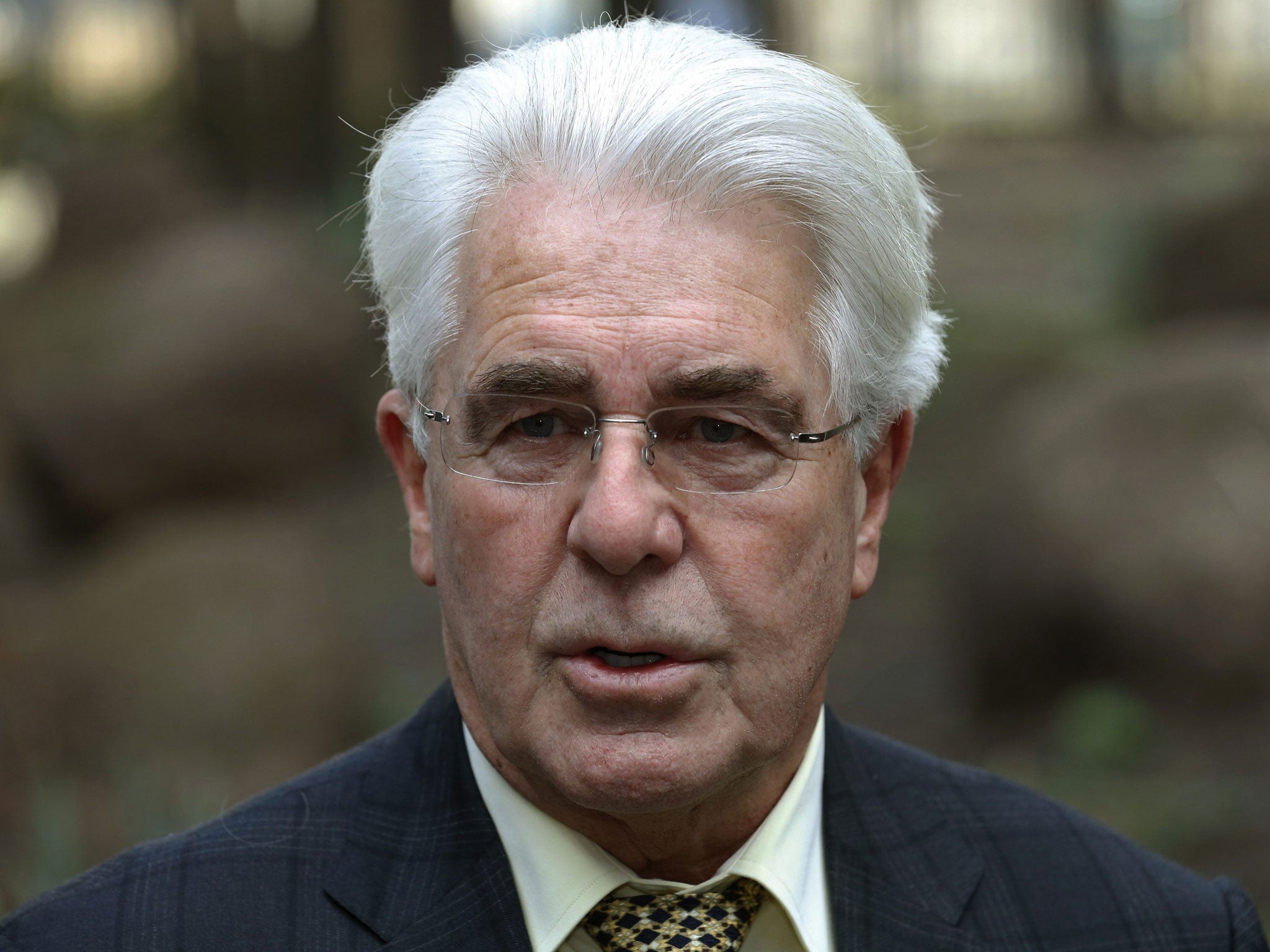 Publicist Max Clifford arrives at Southwark Crown Court in central London March 18, 2014