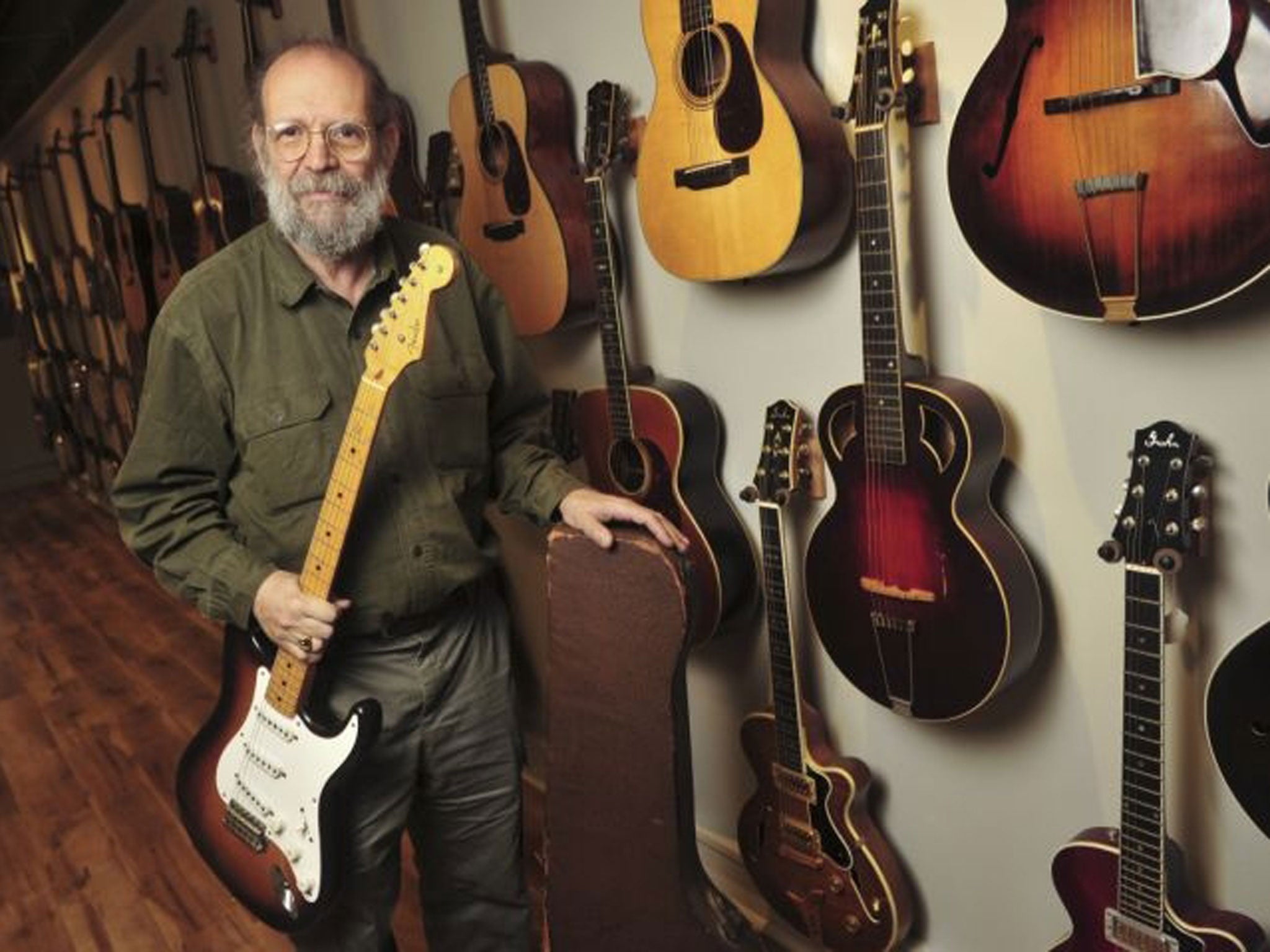 Gruhn Guitars owner George Gruhn holds the first production model Fender Stratocaster