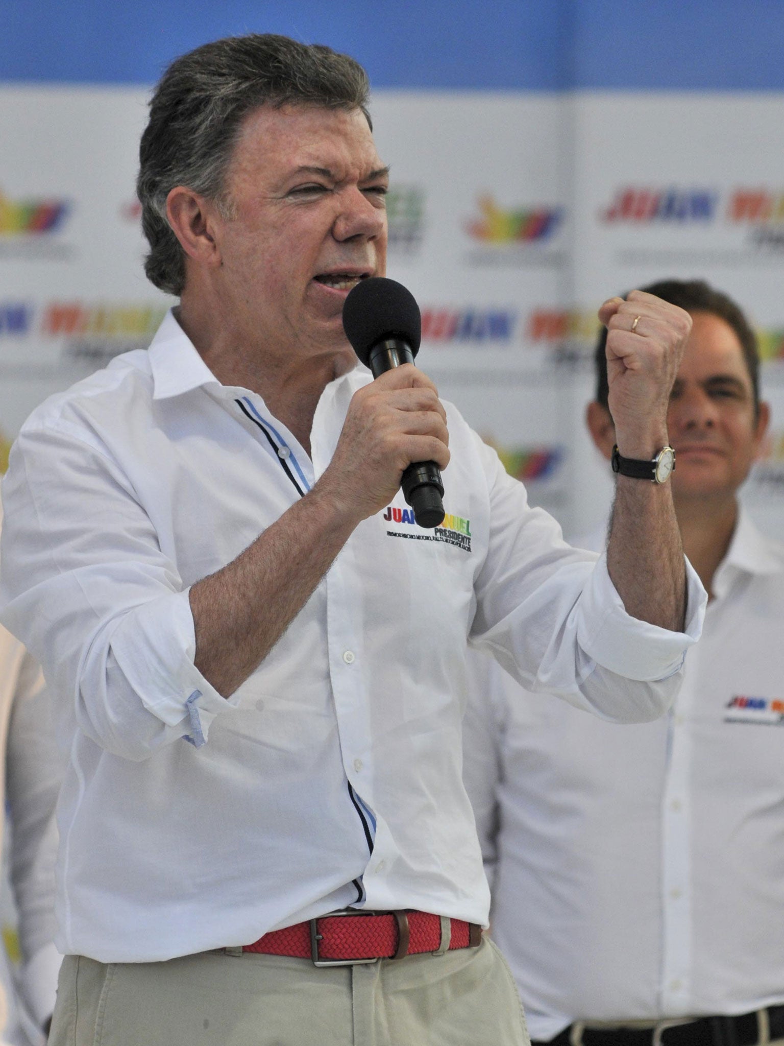 Colombia's President Juan Manuel Santos speaks during a campaign rally at the Tomas Arrieta baseball stadium in Barranquilla, Colombia, Sunday, March 16, 2014. Santos, who is running for re-election, said on a televised statement on Tuesday, March 18, that he suffered an accident of incontinence product of surgery he underwent a year and a half ago to remove prostate cancer, that according to his doctor the accident is normal in patients who have suffered such intervention and that his health is optimal.