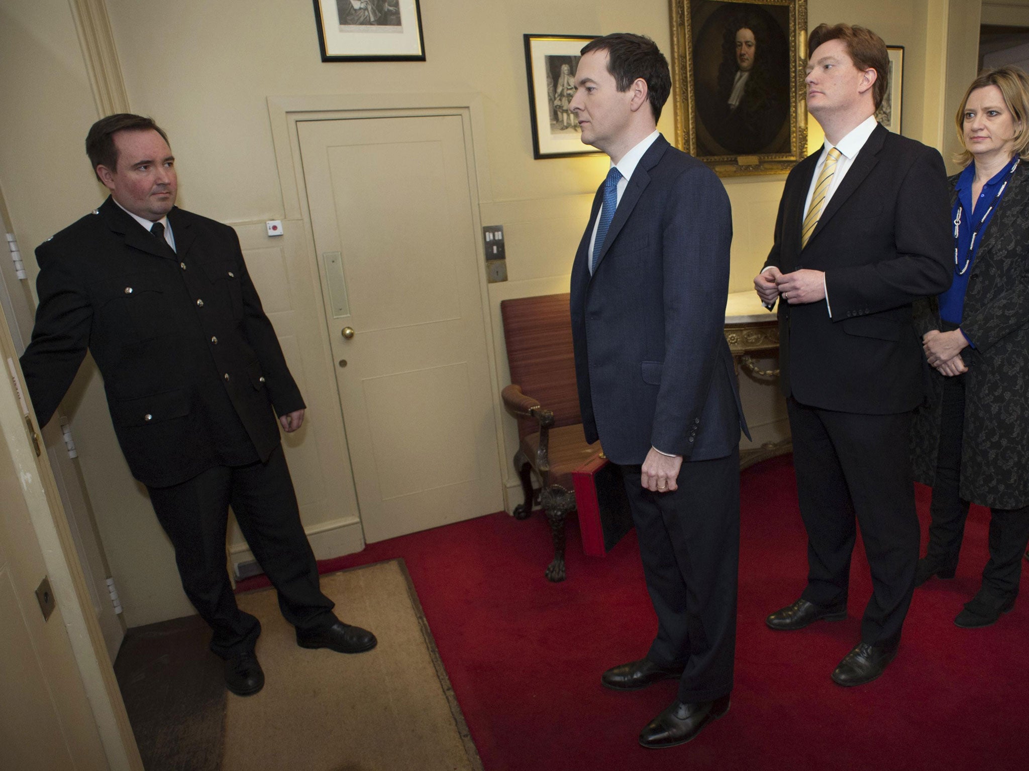 Britain's Chancellor of the Exchequer George Osborne leads his Treasury team as they prepare to leave number 11 Downing Street to pose for photographers before going to the House of Commons to present the Budget