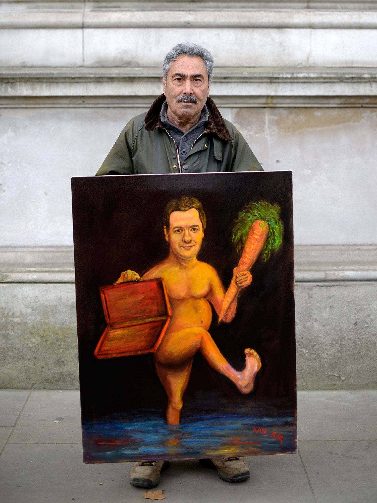 Kaya Mar holds a painting of George Osborne outside downing street ahead of the Budget in London