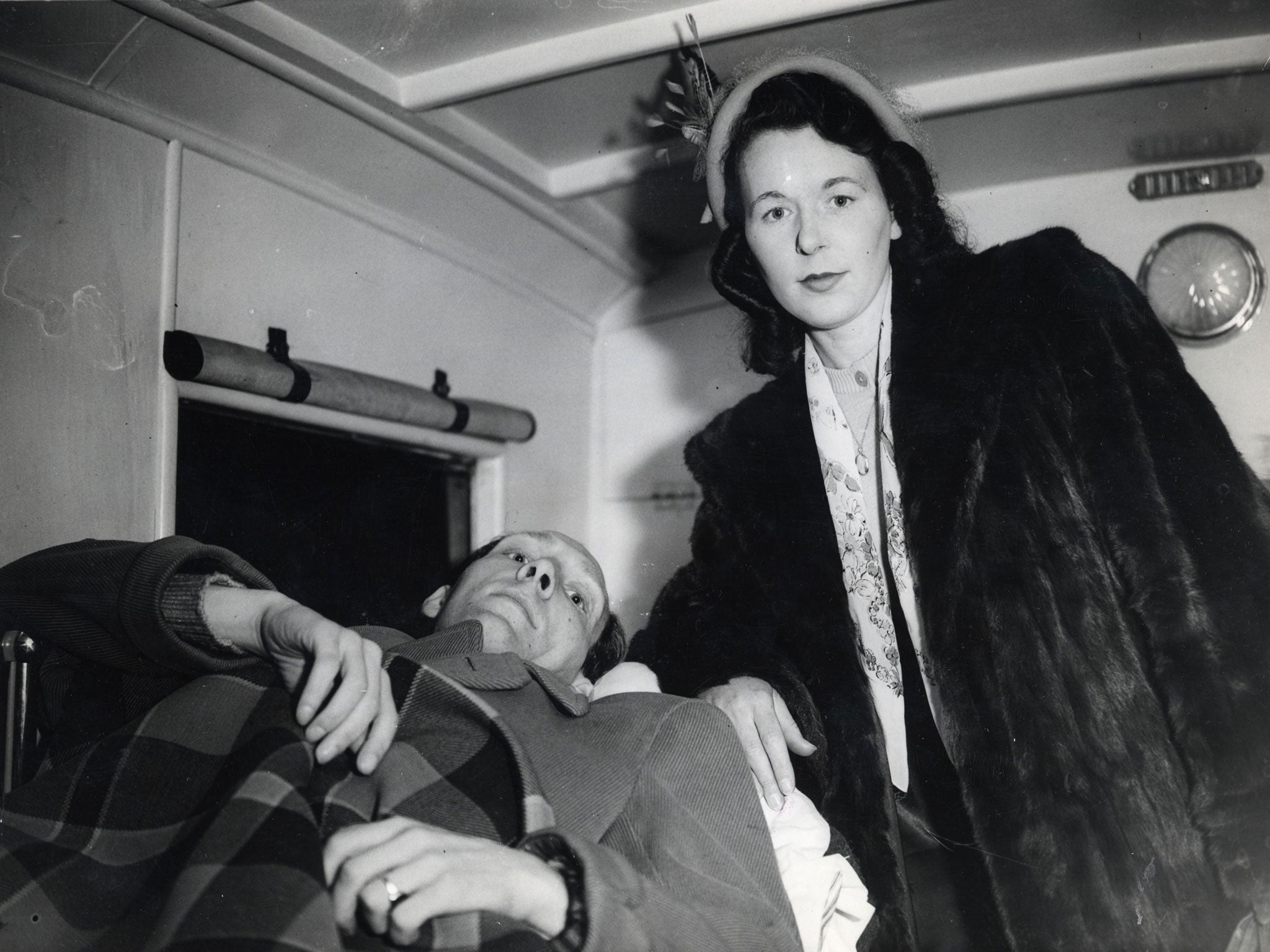 Fade away: Conway in an ambulance with his wife, Lilian