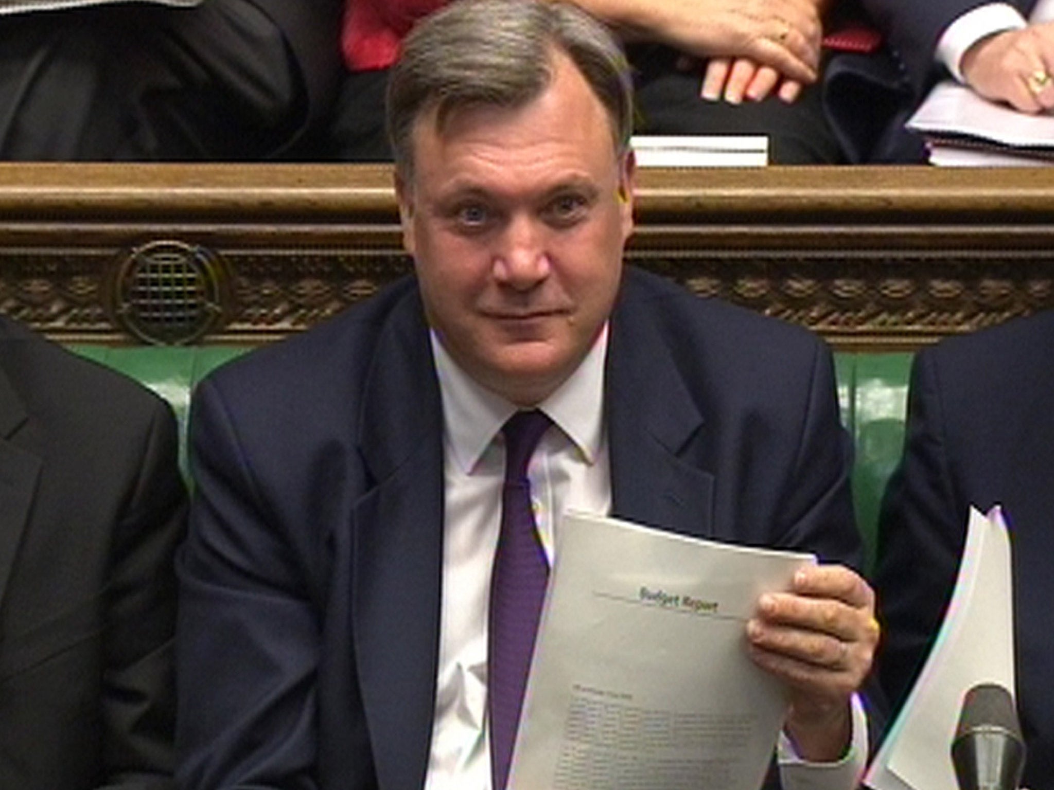 Shadow Chancellor Ed Balls listens as George Osborne delivers his Budget