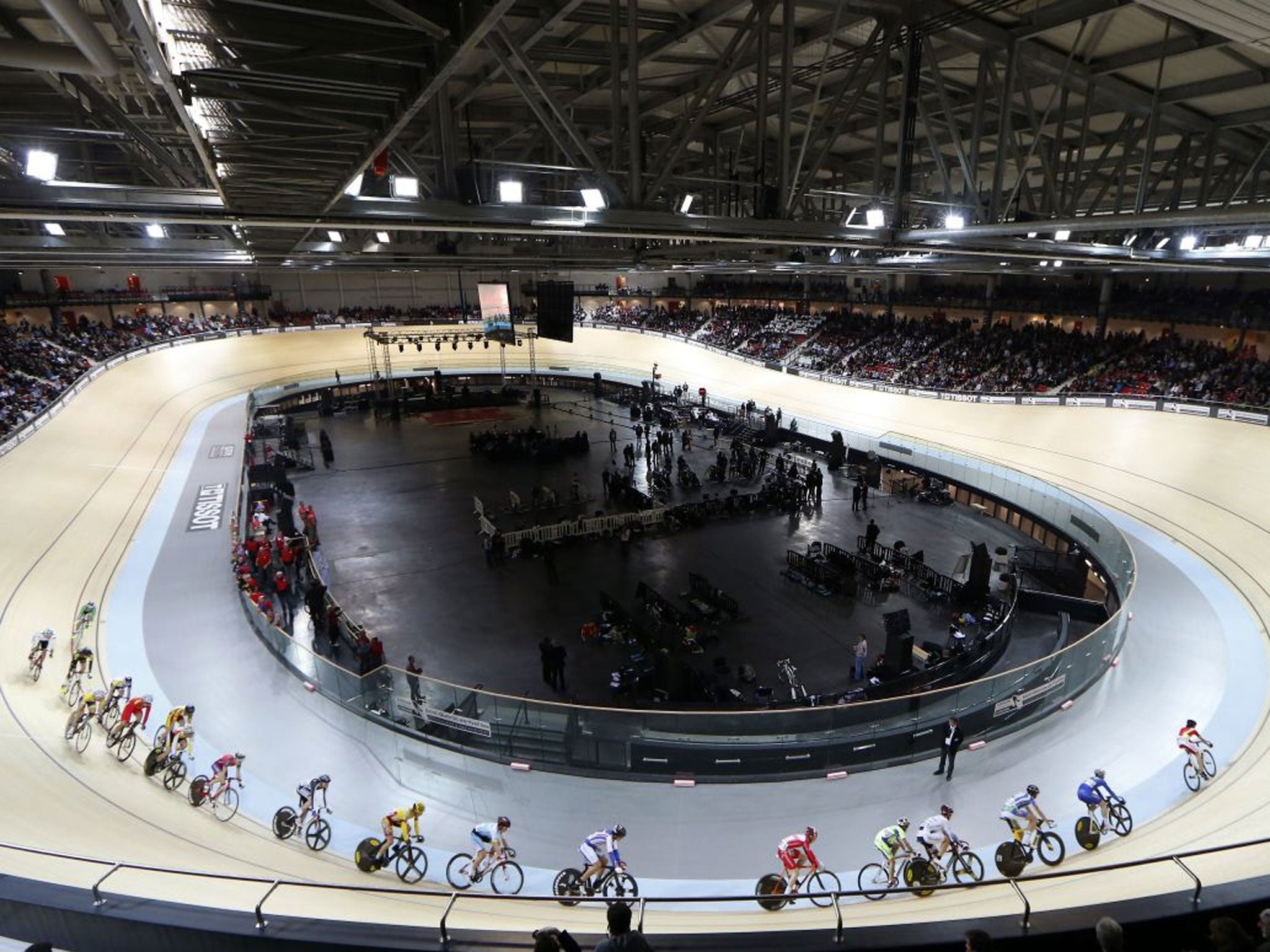 Cyclists race during the inauguration ceremony of the Saint-Quentin-en-Yvelines Velodrome in Montigny-le-Bretoneux