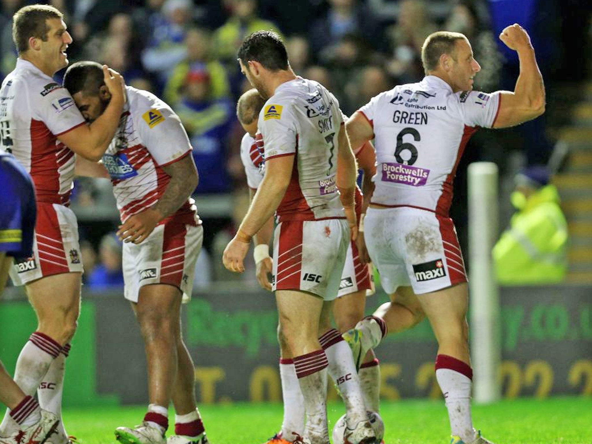 Wigan Warriors Blake Green (right) celebrates scoring during the First Utility Super League match at the Halliwell Jones Stadium, Warrington