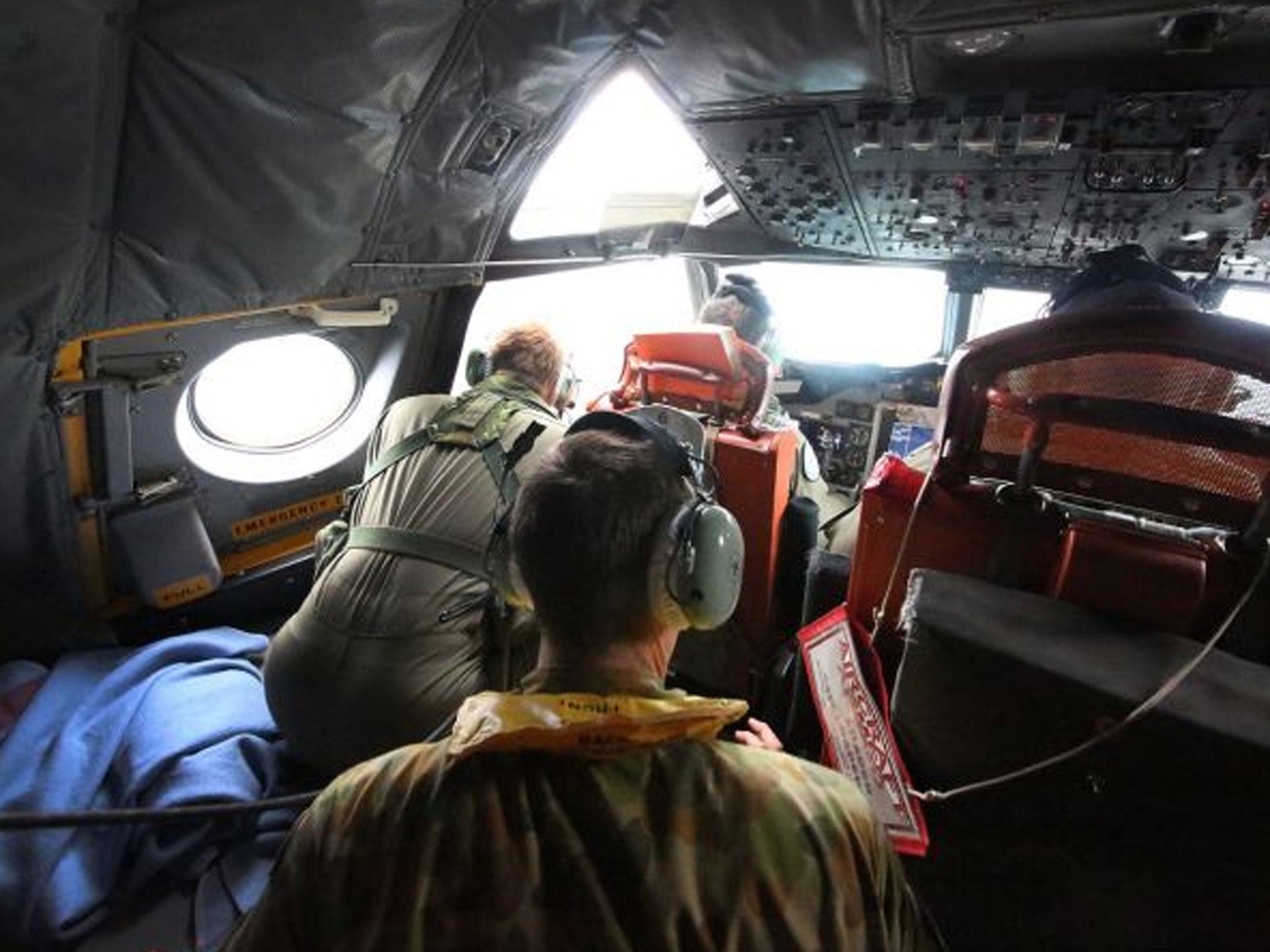 A crew member on a Royal Australian Air Force AP-3C Orion aircraft participating in the Australian Maritime Safety Authority-led search for Malaysia Airlines Flight MH370 in the Southern Indian Ocean