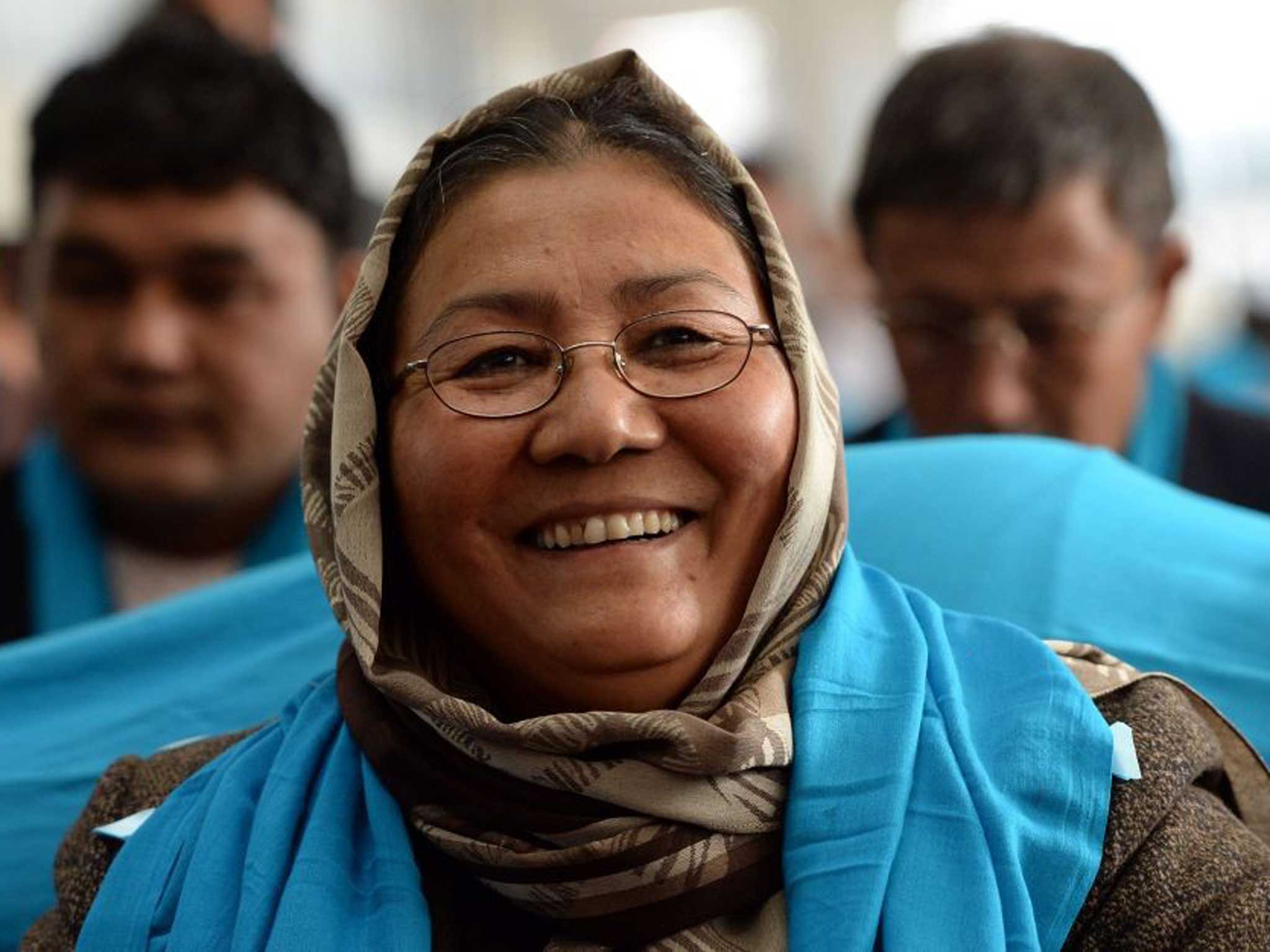 Afghan second vice -presidential candidate Habiba Surabi laughs as she attends an election rally in Kabul earlier this week