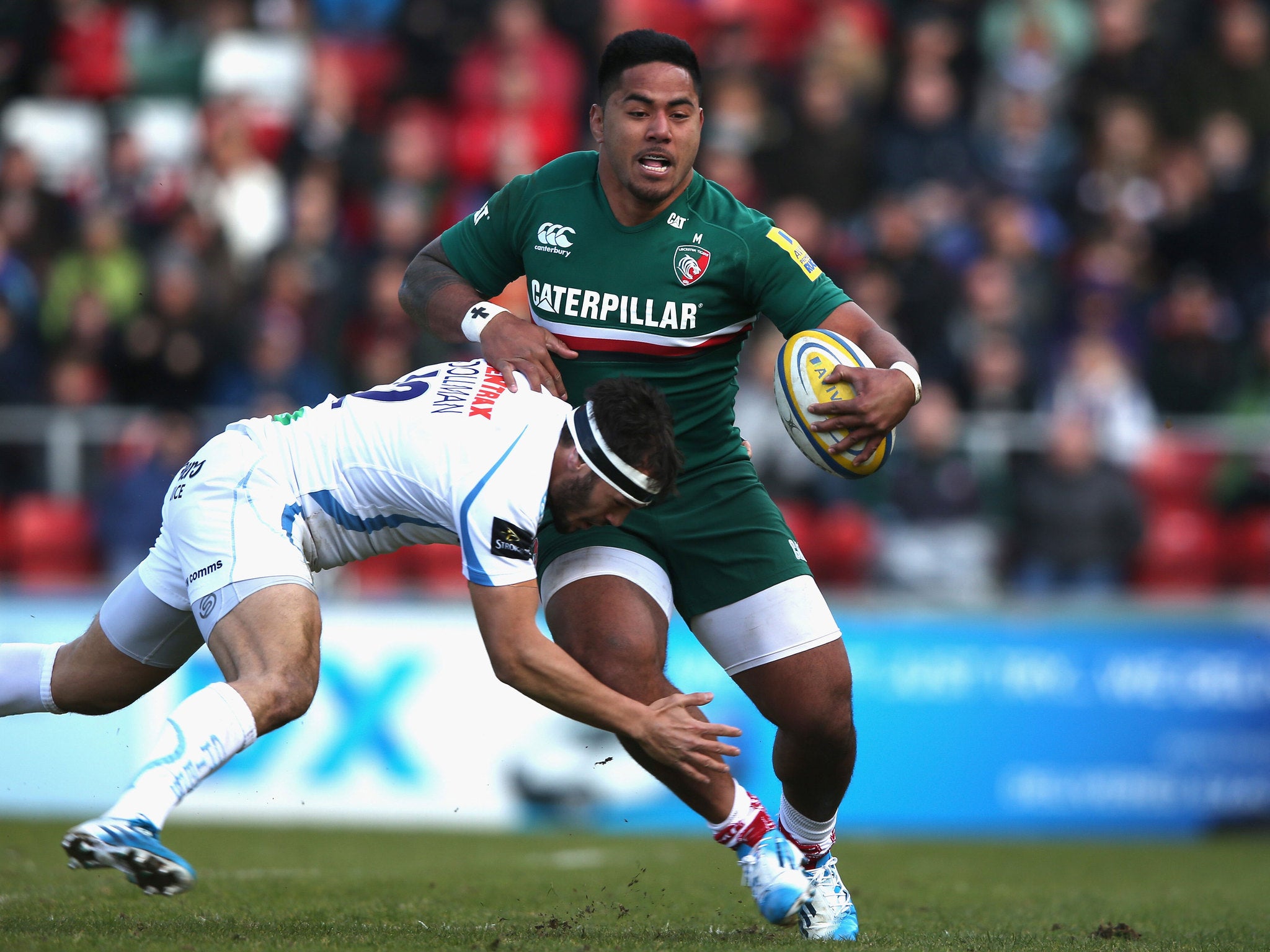 Manu Tuilagi evades Exeter's Phil Dollman to score a try (GETTY)