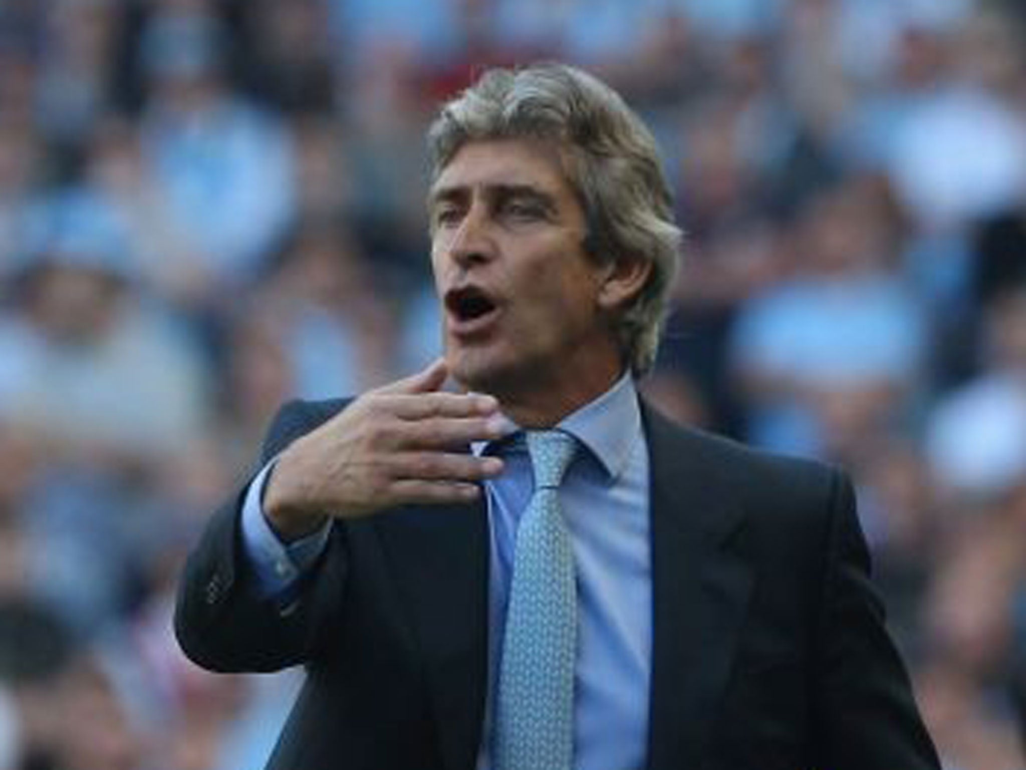 Manuel Pellegrini makes a gesture from the touchline