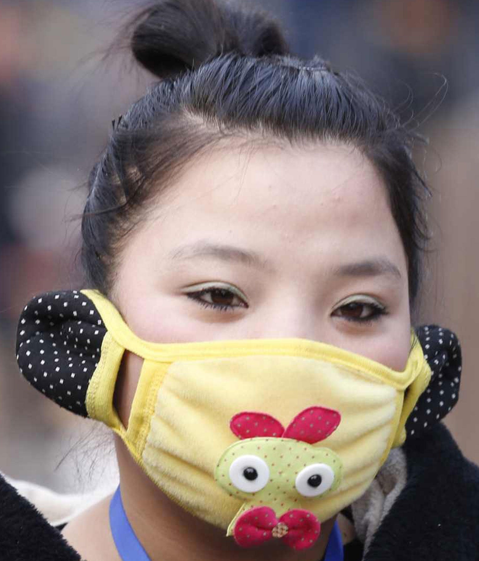 People in Beijing wear face masks during the week-long Chinese New Year holiday