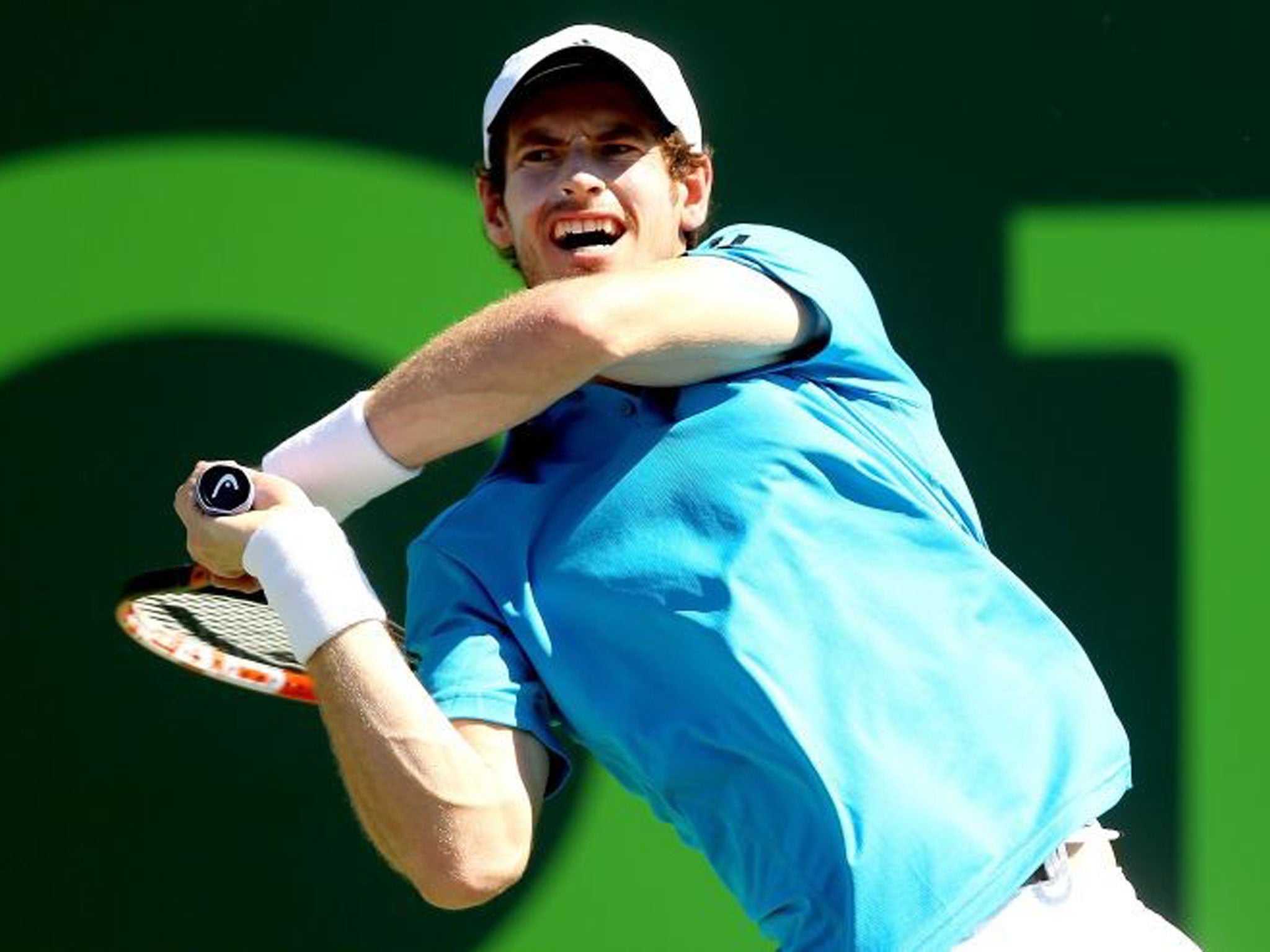 Andy Murray returns a shot to Jo-Wilfired Tsonga