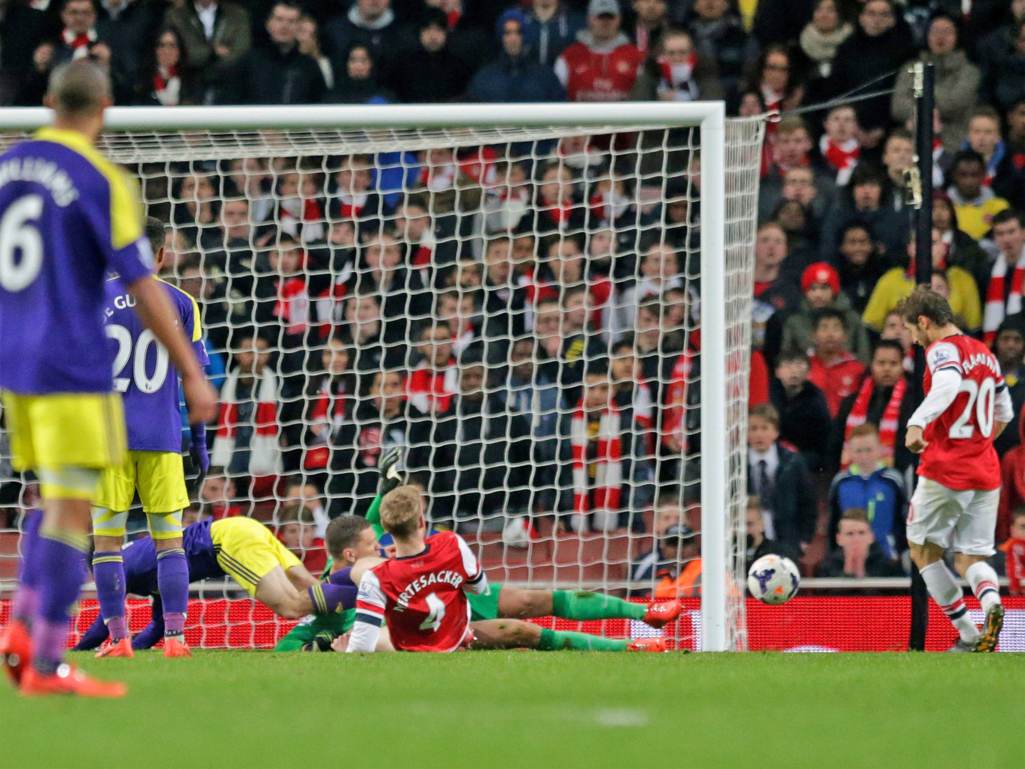 Mathieu Flamini scores a late own goal