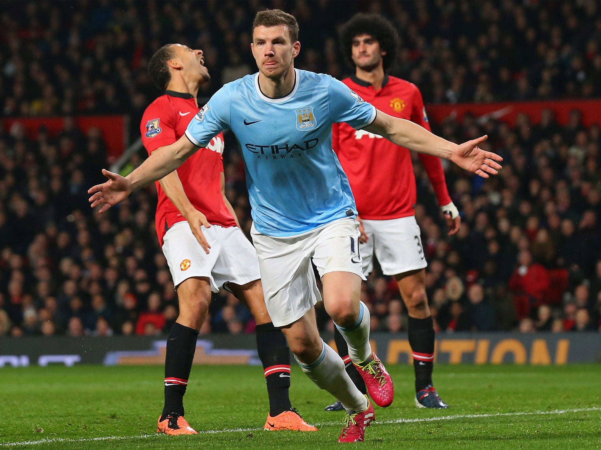 Edin Dzeko celebrates his second goal of the night